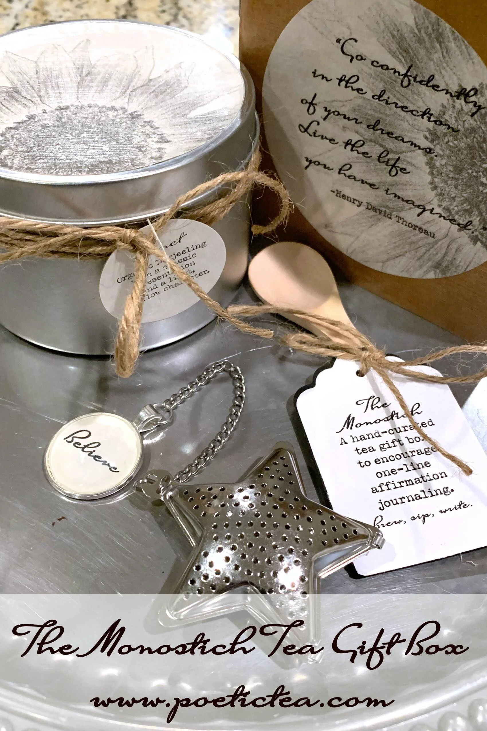 Tea gift box:  loose tea tin, pendant infuser, wooden teaspoon, affirmation journal.