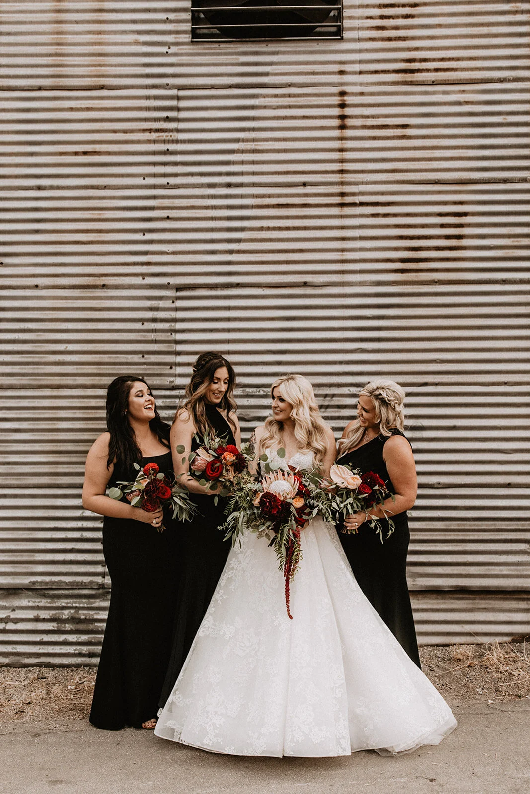 Bride and bridesmaids with moody bouquets at Smoky Hollow Studios in El Segundo