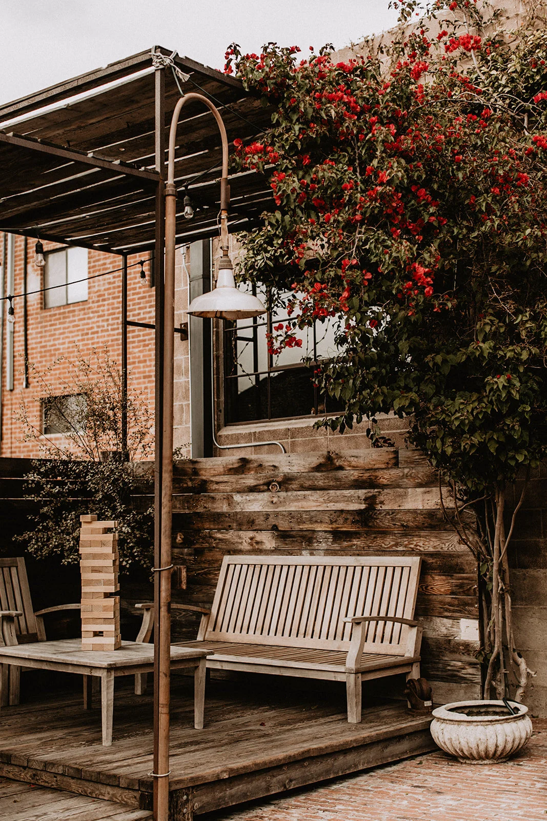 Outdoor reception patio at Smoky Hollow Studios in El Segundo with bougainvillea and Jenga