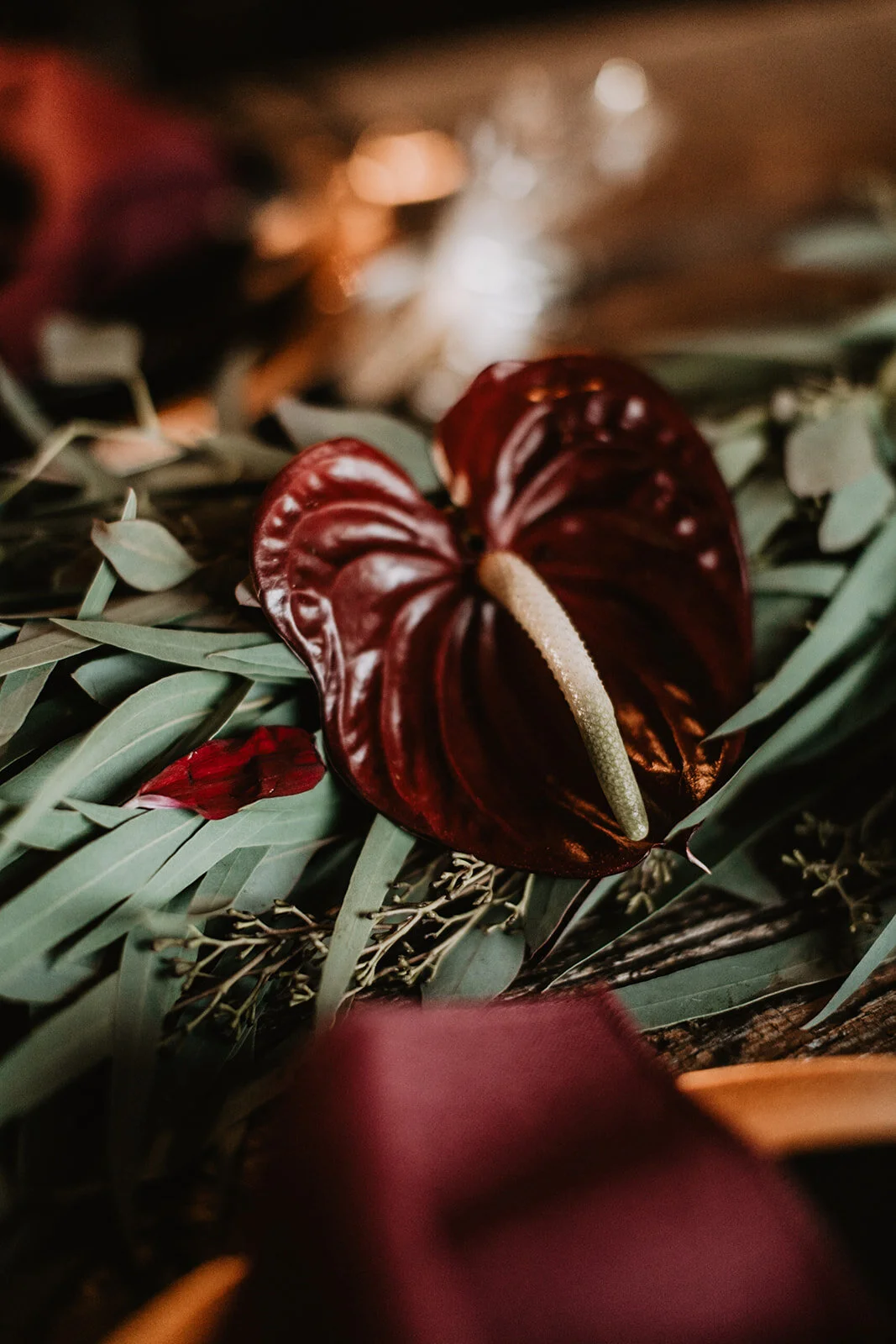 Red anthurium garland for moody dramatic tablescape