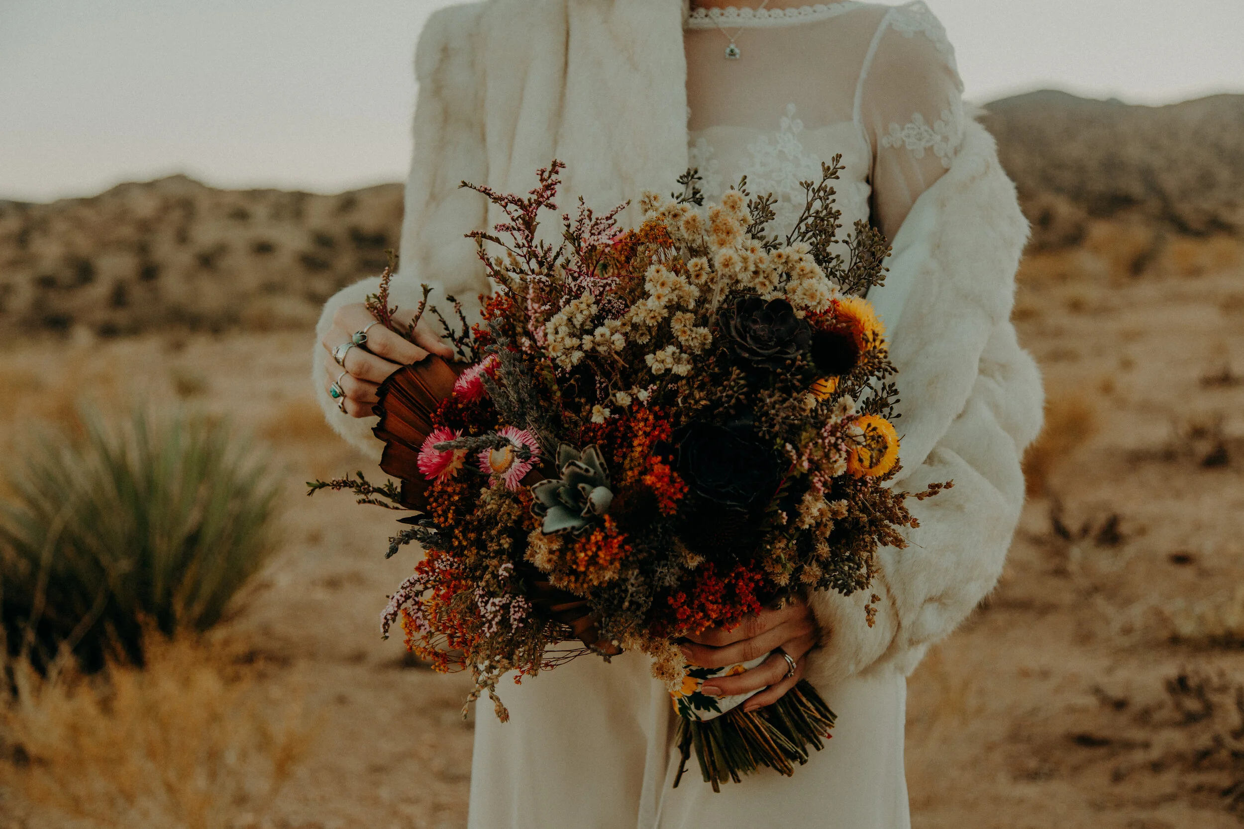  Another outdoor California wedding with a native-inspired bouquet. This time in the desert and with dried flowers! This bouquet tells a story. With some flowers being picked on local hikes, some are succulents from the gardens of the bride’s family,