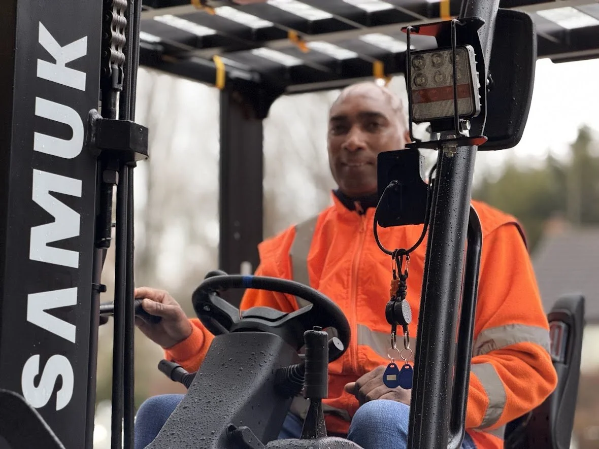Person sitting at a desk using a laptop