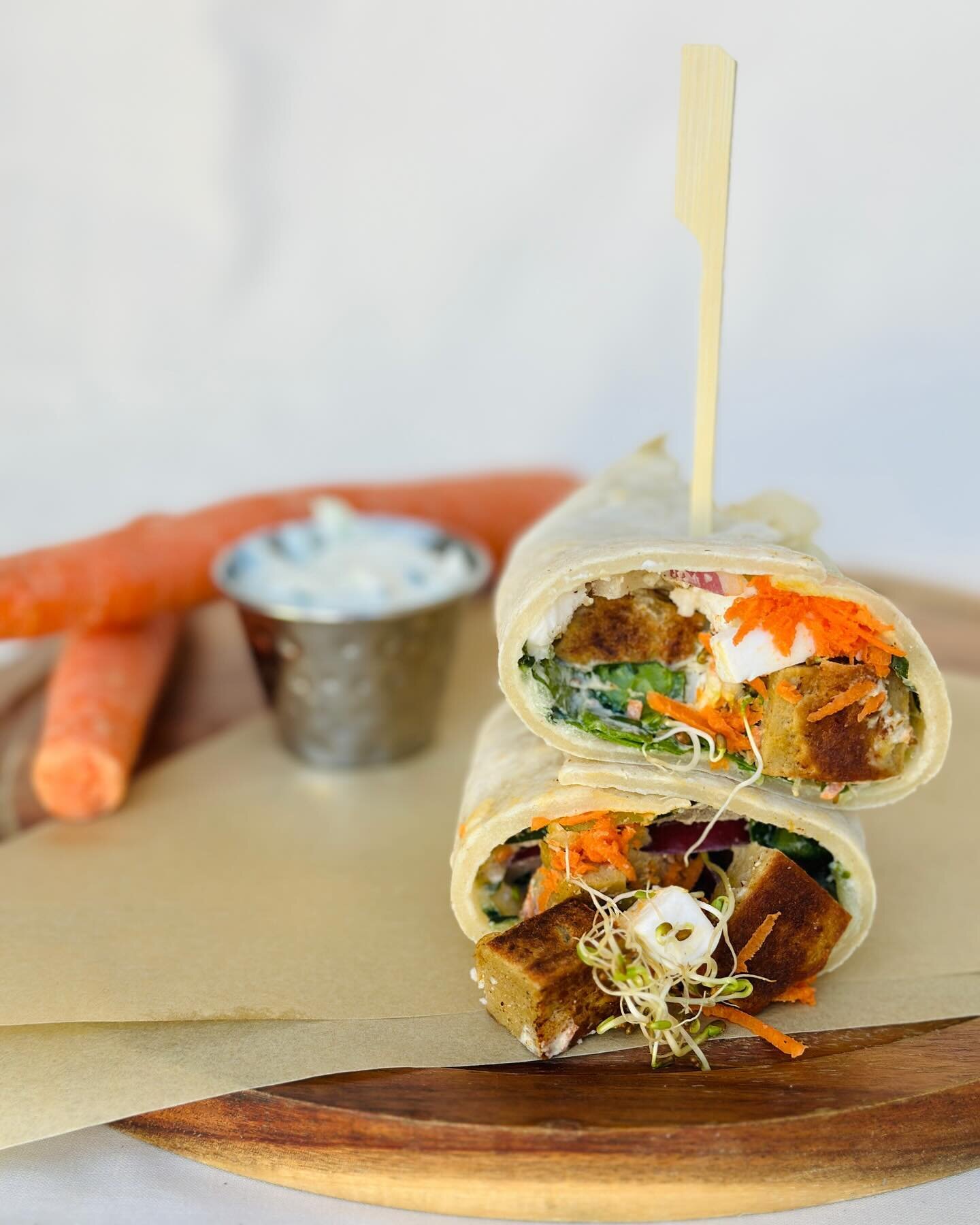 P I T A W R A P

Have you tried our new food menu?

Our pita wrap is SO GOOD - ya gotta try it. 

House made pita wrap filled with our
own grilled vegan chicken, vegan feta, carrots, sprouts, cucumber, spinach,
red onion, and tzatziki sauce. 
*contai