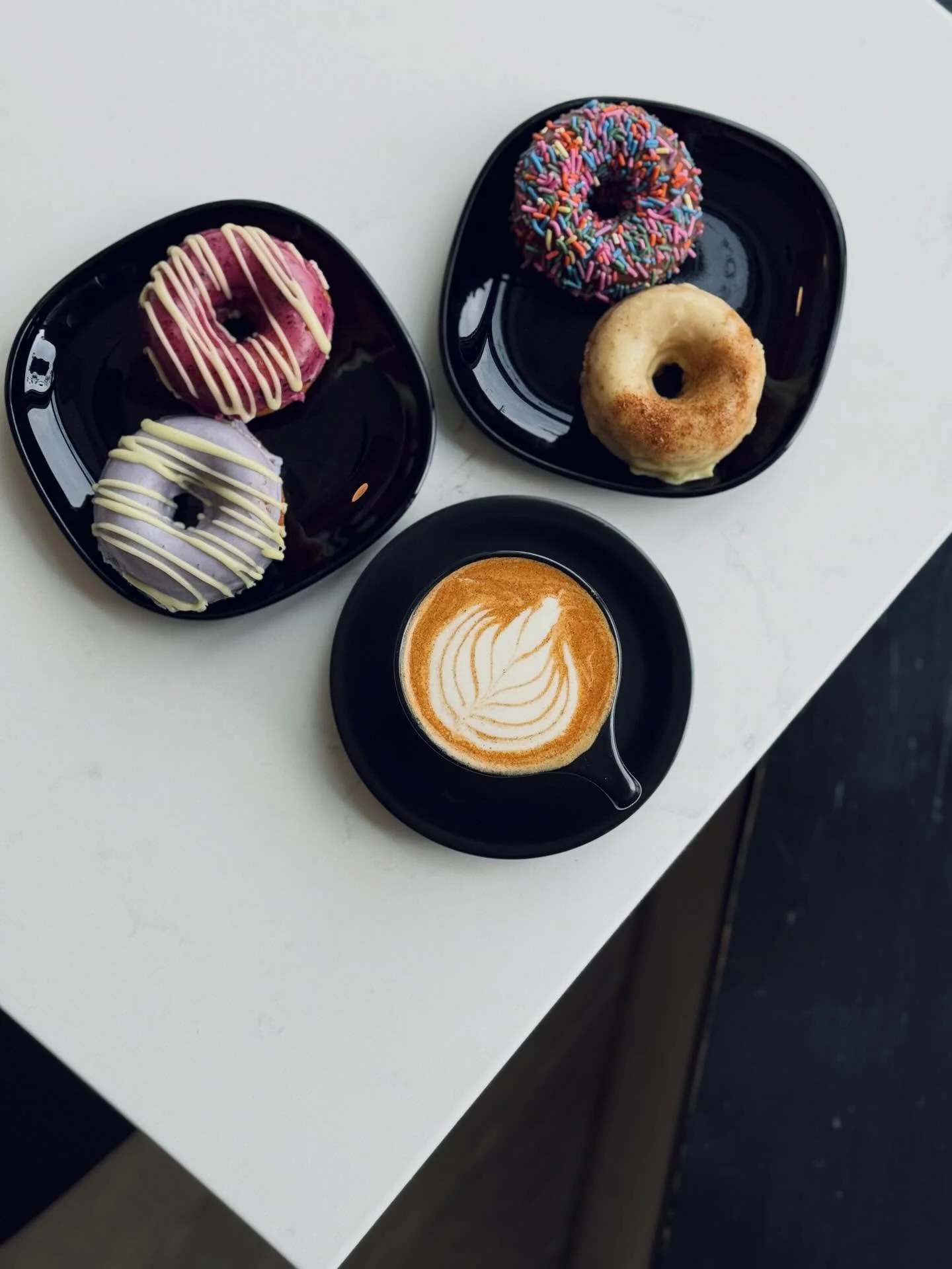 🏅BREAKFAST OF CHAMPIONS🏅

Oat milk cappuccino and a few donuts 👌

Today&rsquo;s donut flavors are Classic Chocolate Sprinkle, Classic Mango Tajin, Lemon Lavender &amp; Lemon Blueberry!