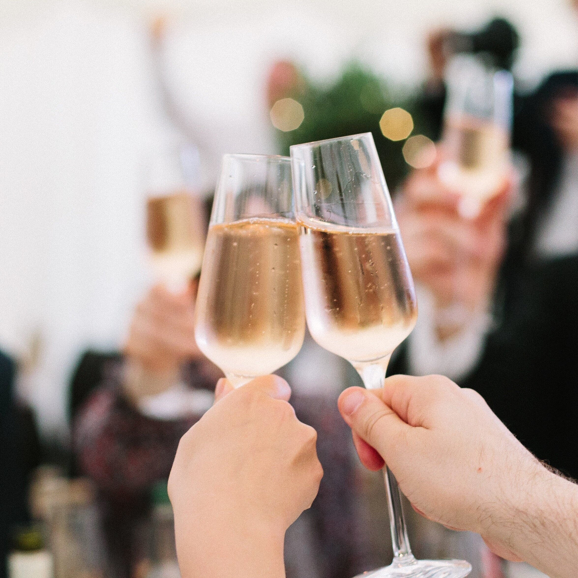 Cheering wine in a wedding ceremony at Boutwoods Kitchen