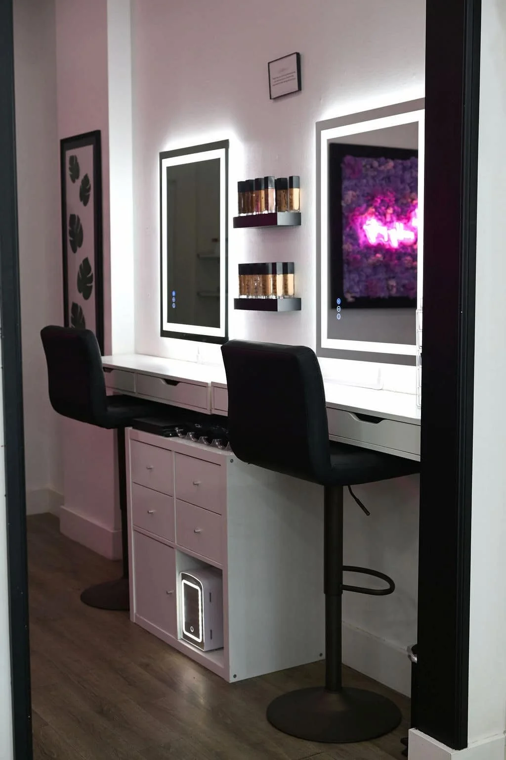 Makeup stations with lighted mirrors inside the Live Blow Dry salon