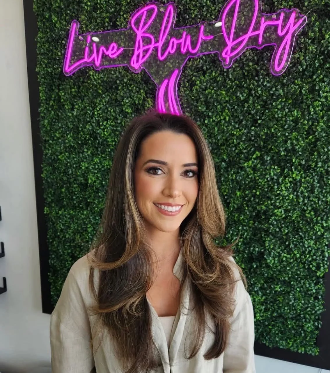 Client with a smooth brunette blowout at Live Blow Dry
