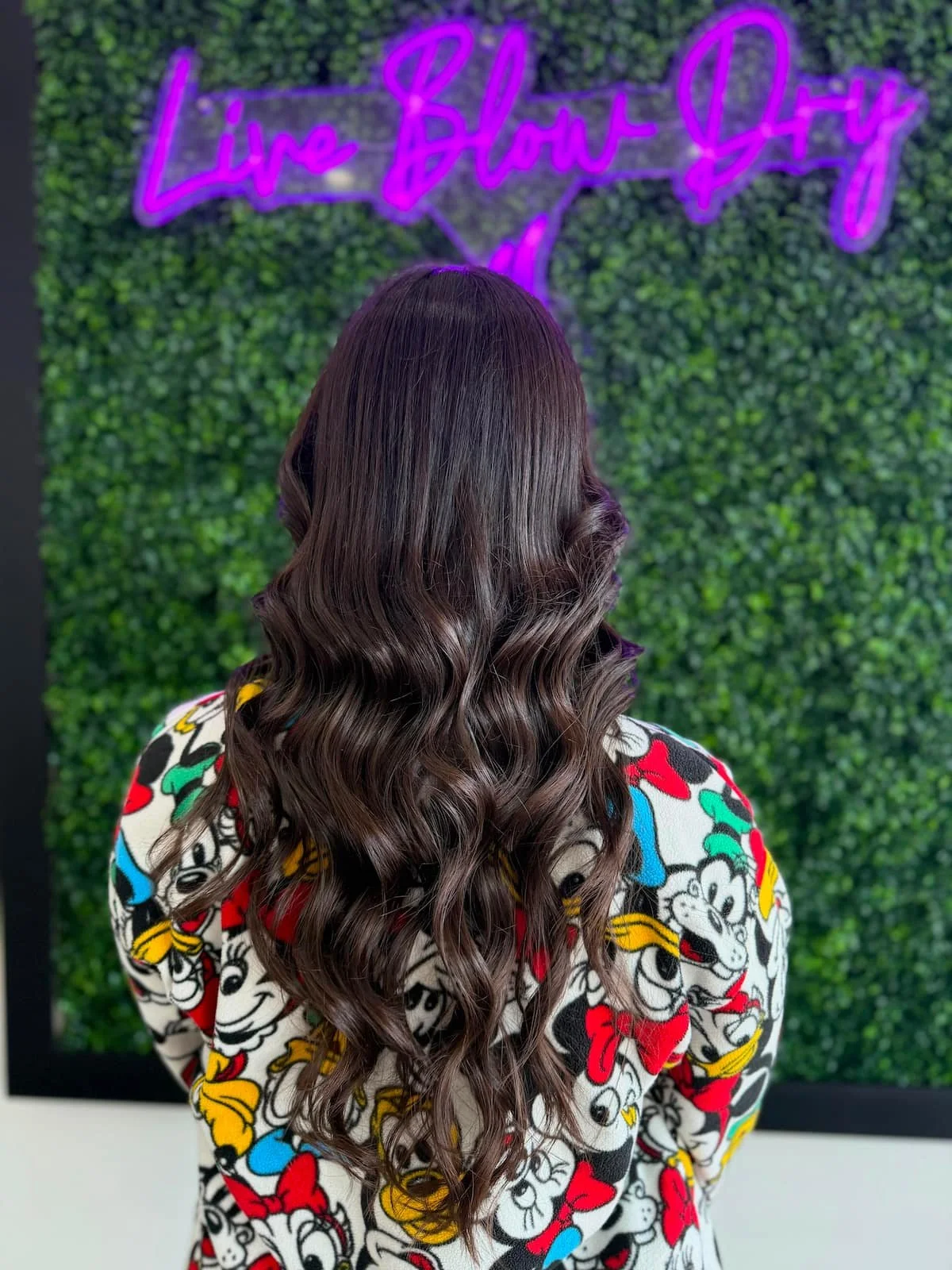 Back view of a long wavy brunette blowout at Live Blow Dry