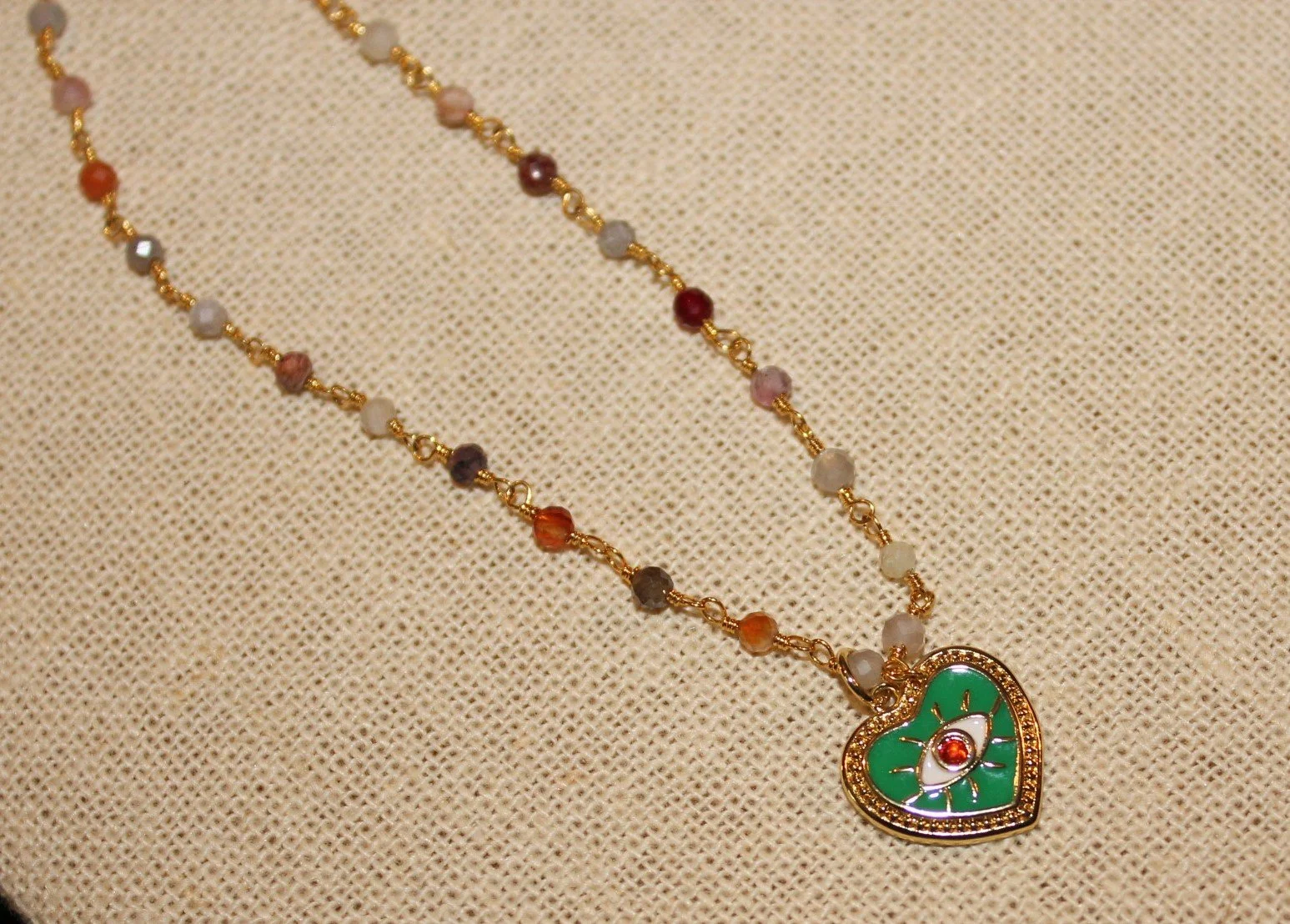 Multi Crystal Chain & Heart Eye Pendant