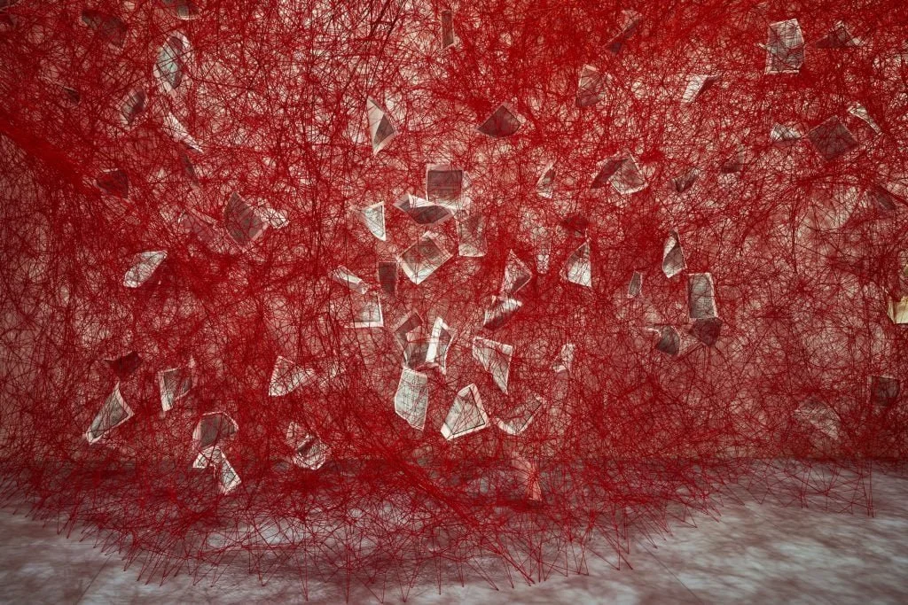Artnet: How Chiharu Shiota Weaves a Web of Memory and History, Thread by Thread