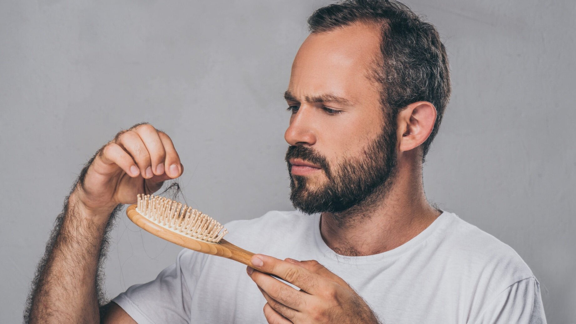 a man holding a snake