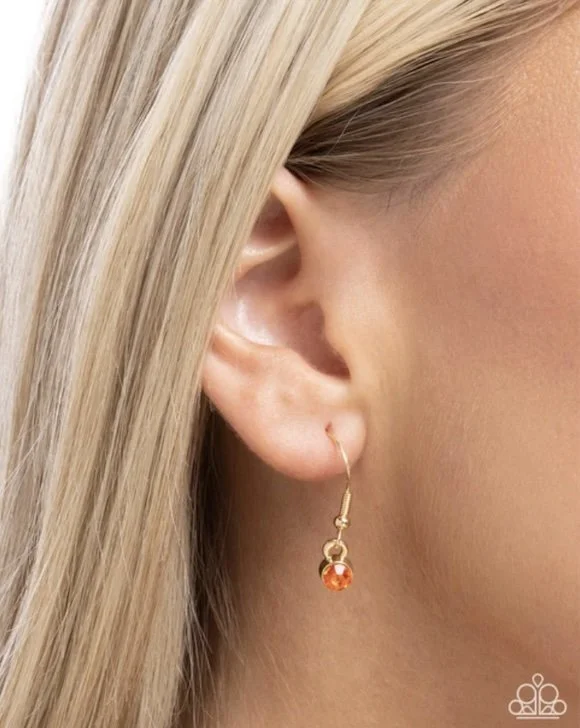pumpkin panache earrings model CP 10:25.jpg