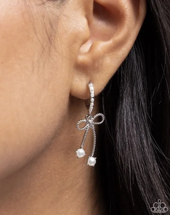 charming coquette white:silver colored bow-tie earrings CP model.jpg