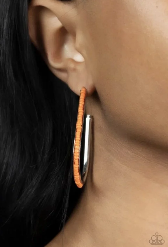 beaded bauble orange earrings model earrings.jpg