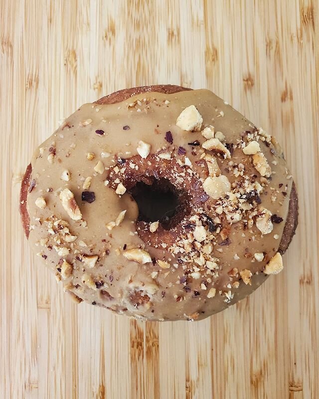 The coffee hazelnut donut! Tender cake donut glazed with @broadcastcoffee espresso glaze and topped with crushed toasted hazelnuts.  In this week's Weekend Survival Box! This is also your last chance to get your hands on the rhubarb pecan tart in the