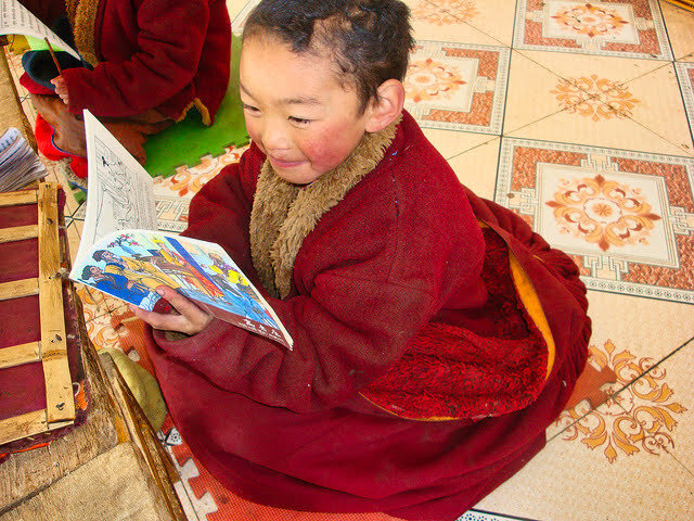 Tibetan.kid.enjoying.books.jpg