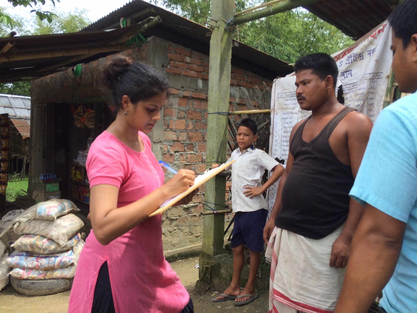 A vendor at a public distribution system shop shares his perspectives on housing and basic services