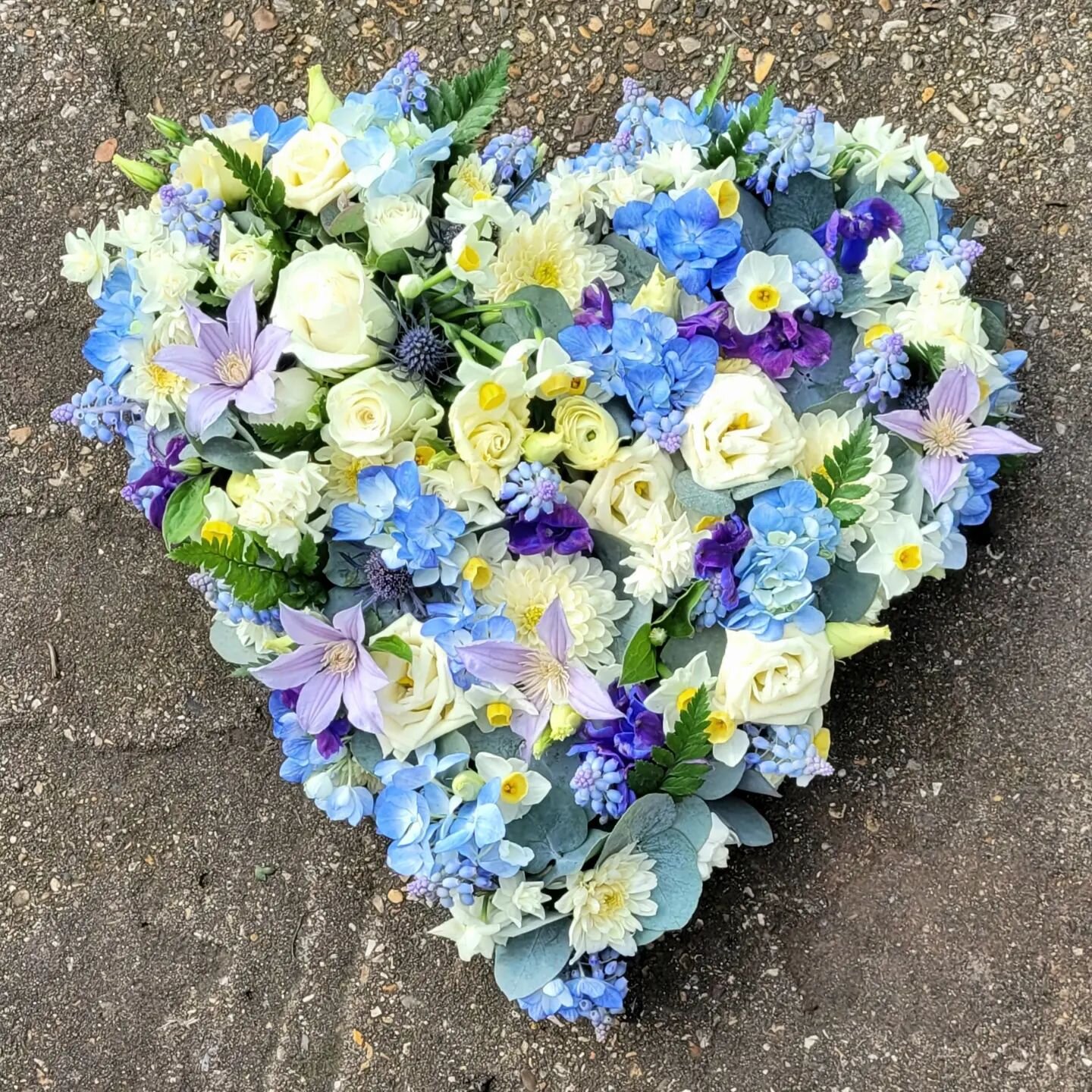 Such beautiful colours in this spring heart made by @theresa.bishop28 for a gentlemans funeral this afternoon #funeralflowers #springblues #farewellflowers #heart