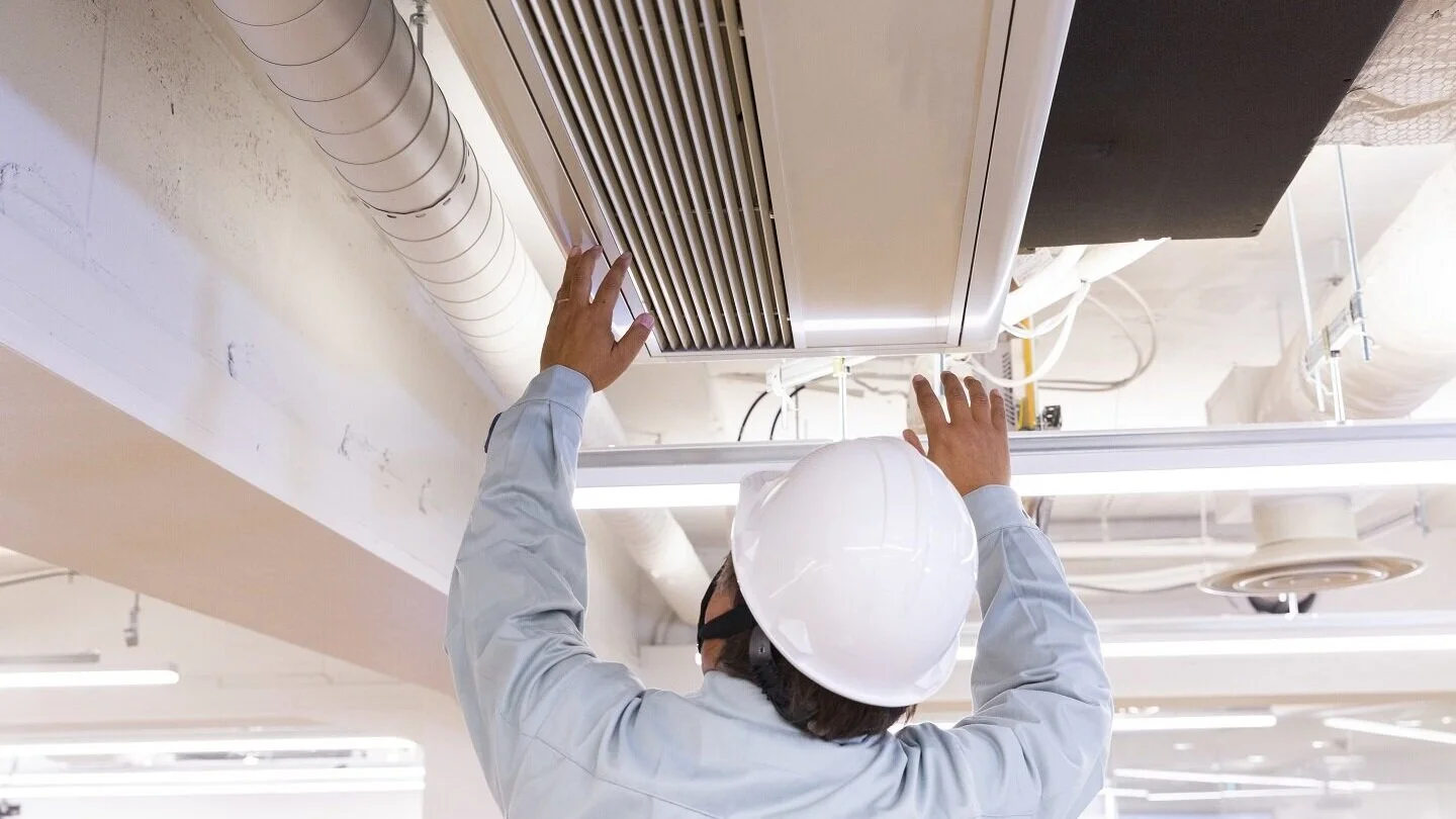Repairman+fixing+commercial+ductwork_AdobeStock_260282787_LR.jpg