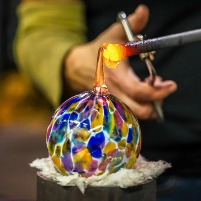 ✨ Blow Your Own Glass Bauble

Come into the hot glass studio and create your own hand-blown glass bauble.

In this short one-to-one style experience you&rsquo;ll work with molten glass from the furnace and blow a piece to take home. Each bauble is co