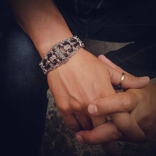 It is impossible not to fall in love with this bracelet!  Feels so nice on the wrist and looks cool.  Sterling silver with rubber cord.  Has 8 uniquely designed parts, with total of 12-14 pieces per bracelet depending on the size.  Weights 59-62 gram
