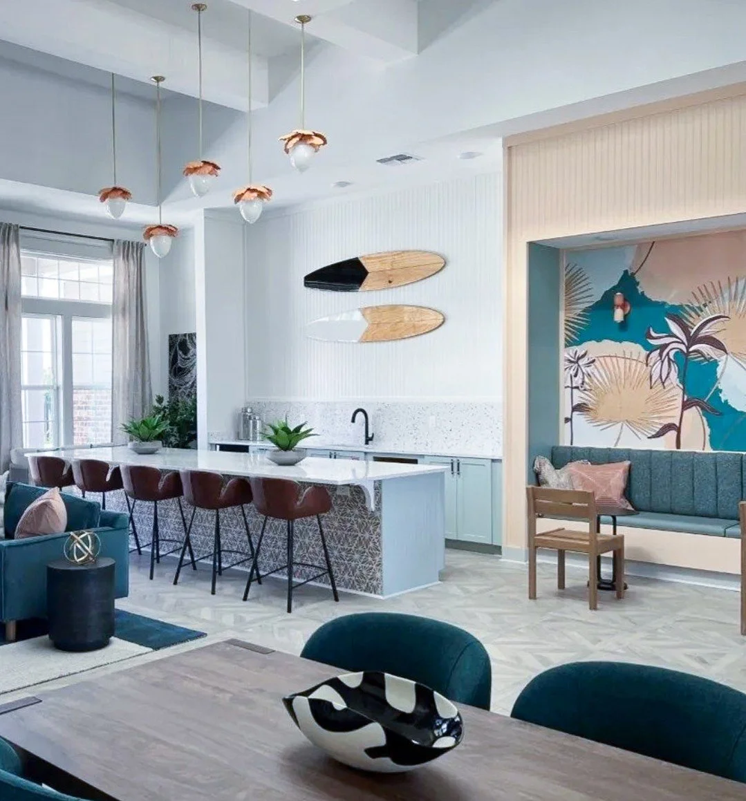 Surfside meets modern living in Panama City. Our hand-painted, epoxy-resin surfboard installation&mdash;designed with concealed &ldquo;floating&rdquo; mounts&mdash;brings vibrant, Coast-inspired artistry into this amenity space at Arbor Crossing at M