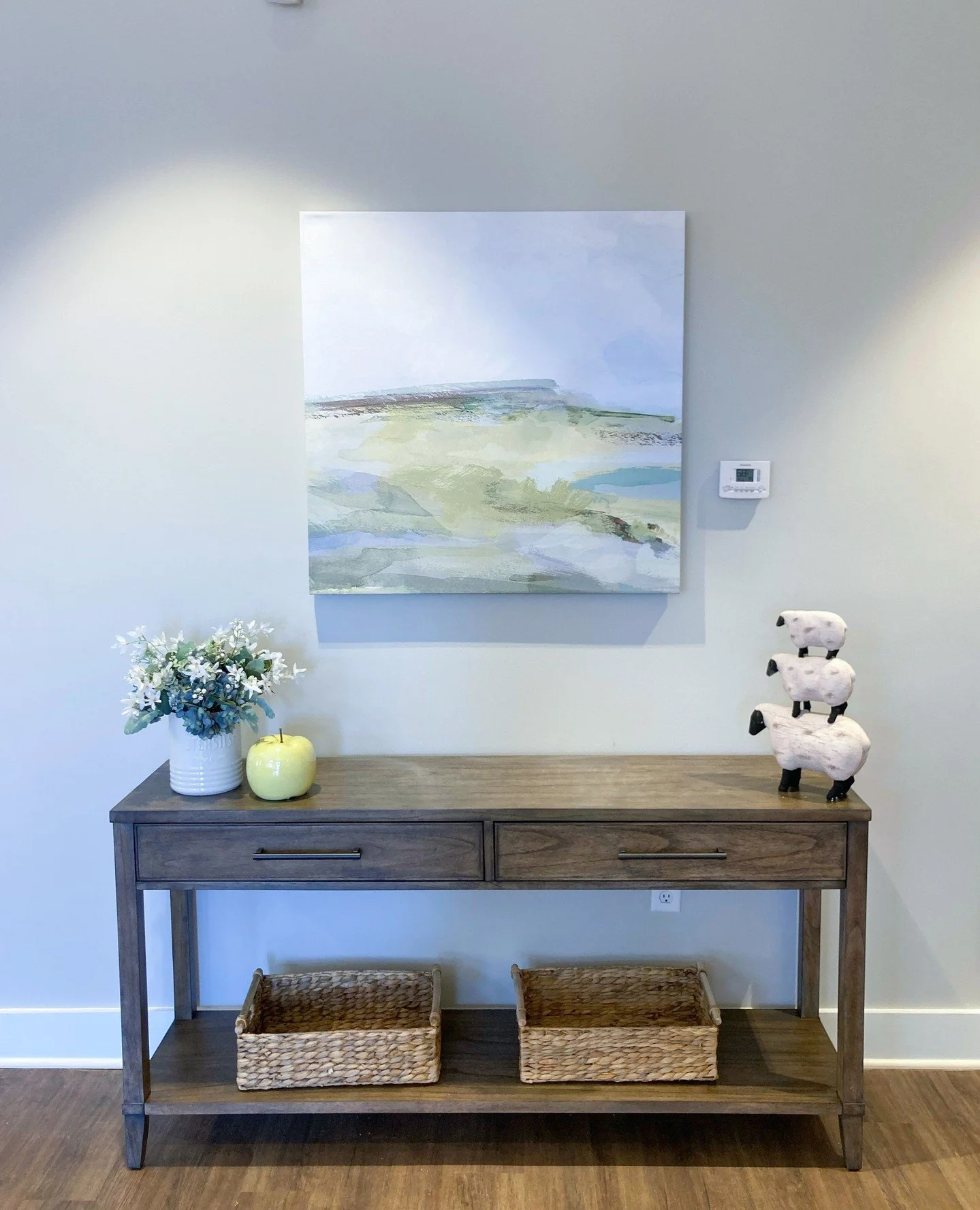 Quiet art, thoughtful styling.⁠
A soft abstract anchored by curated accessories for a look that feels intentional and complete.