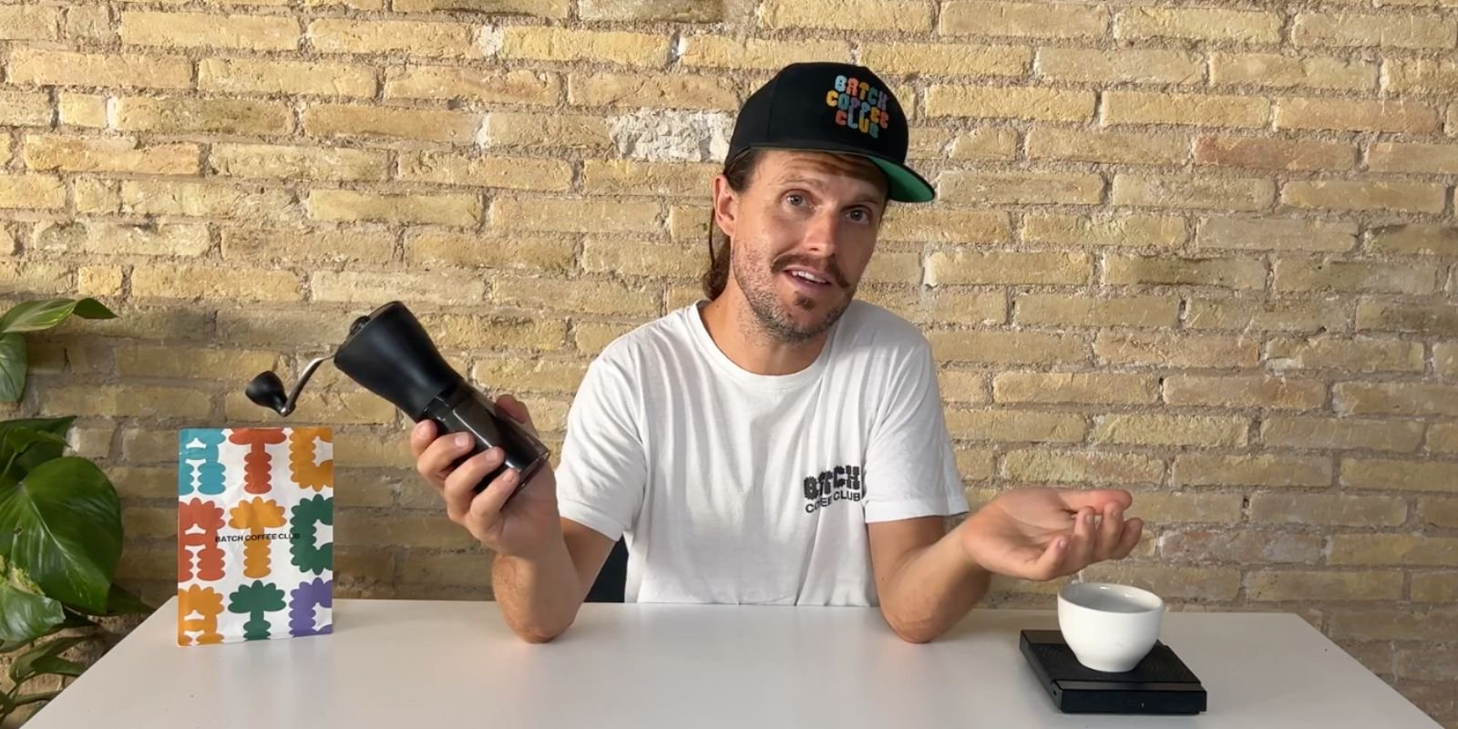 Tom using a timemore coffee grinder.jpg