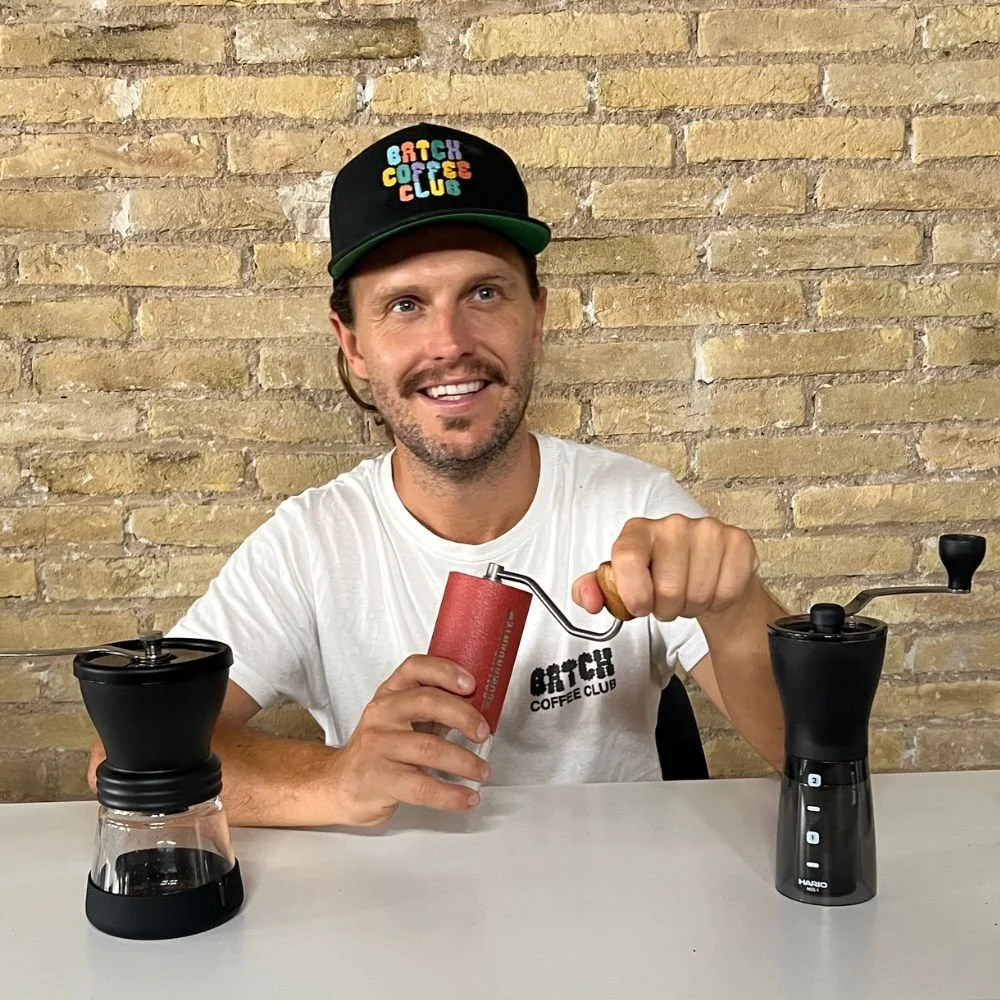Tom using a manual coffee grinder