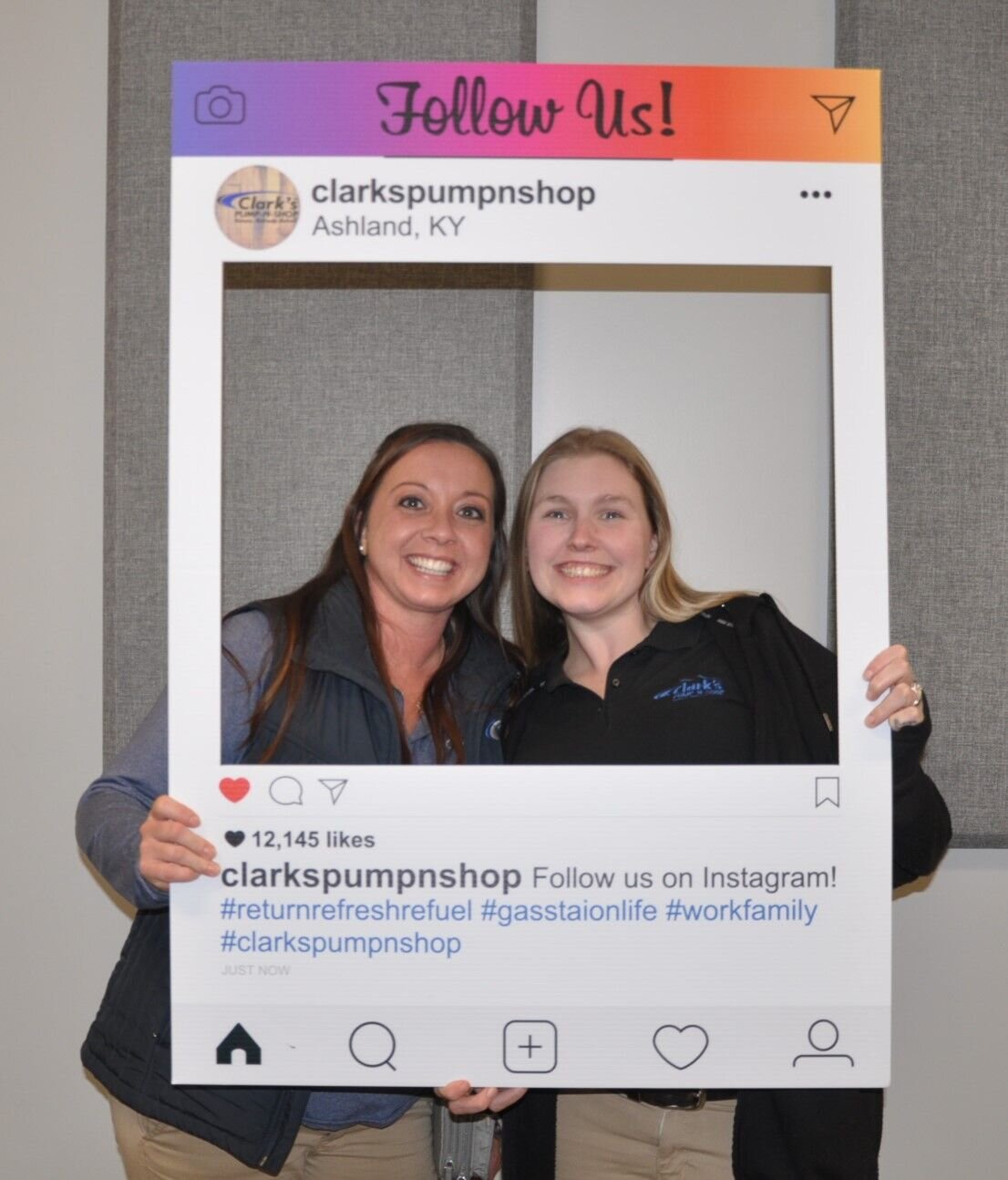 2 Full Time Clark's Pump-N-Shop Managers holding an instagram frame