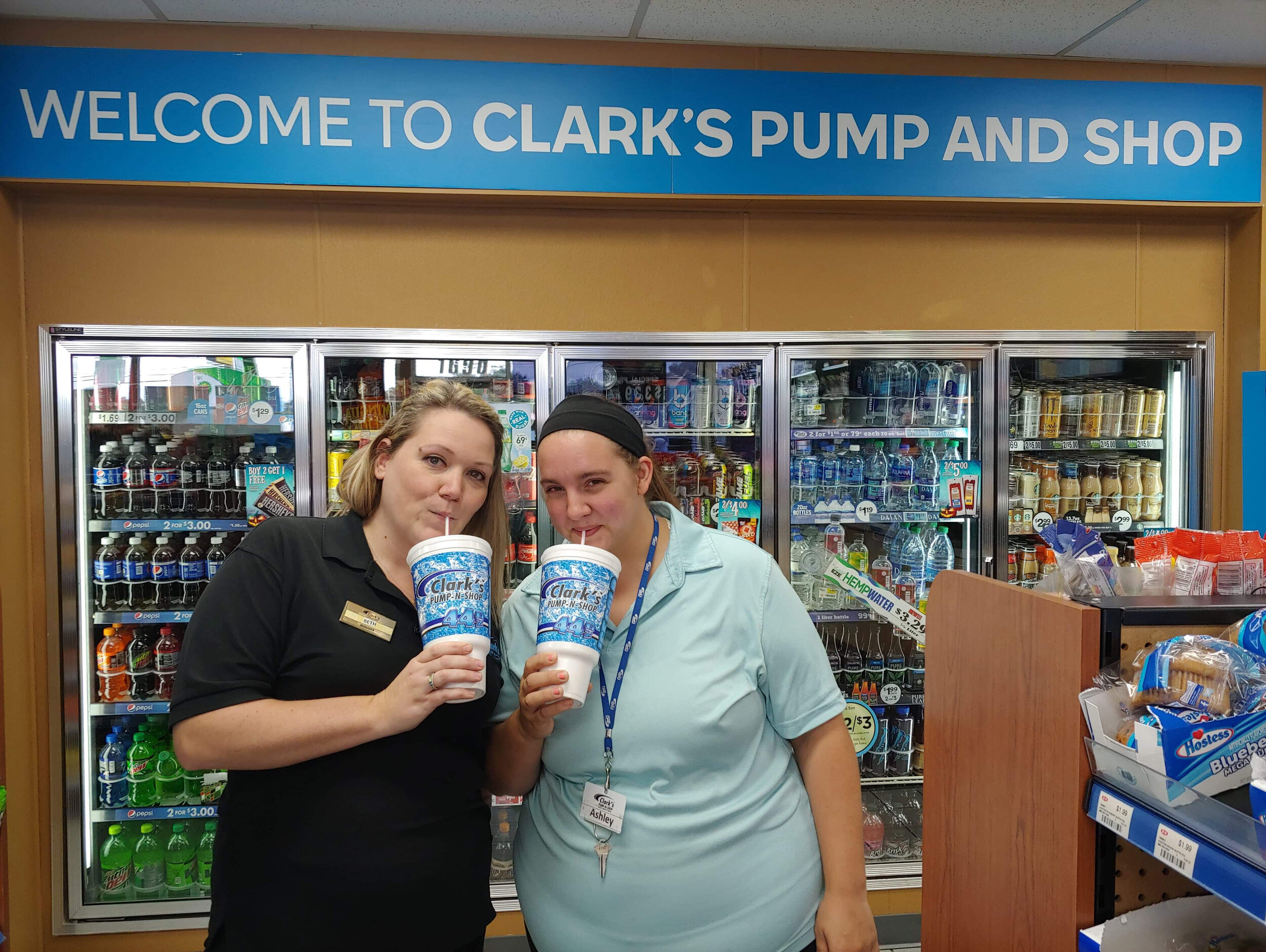 Clark's Pump-N-Shop Manager and Assistant Manager from Morehead, KY with a fountain drink