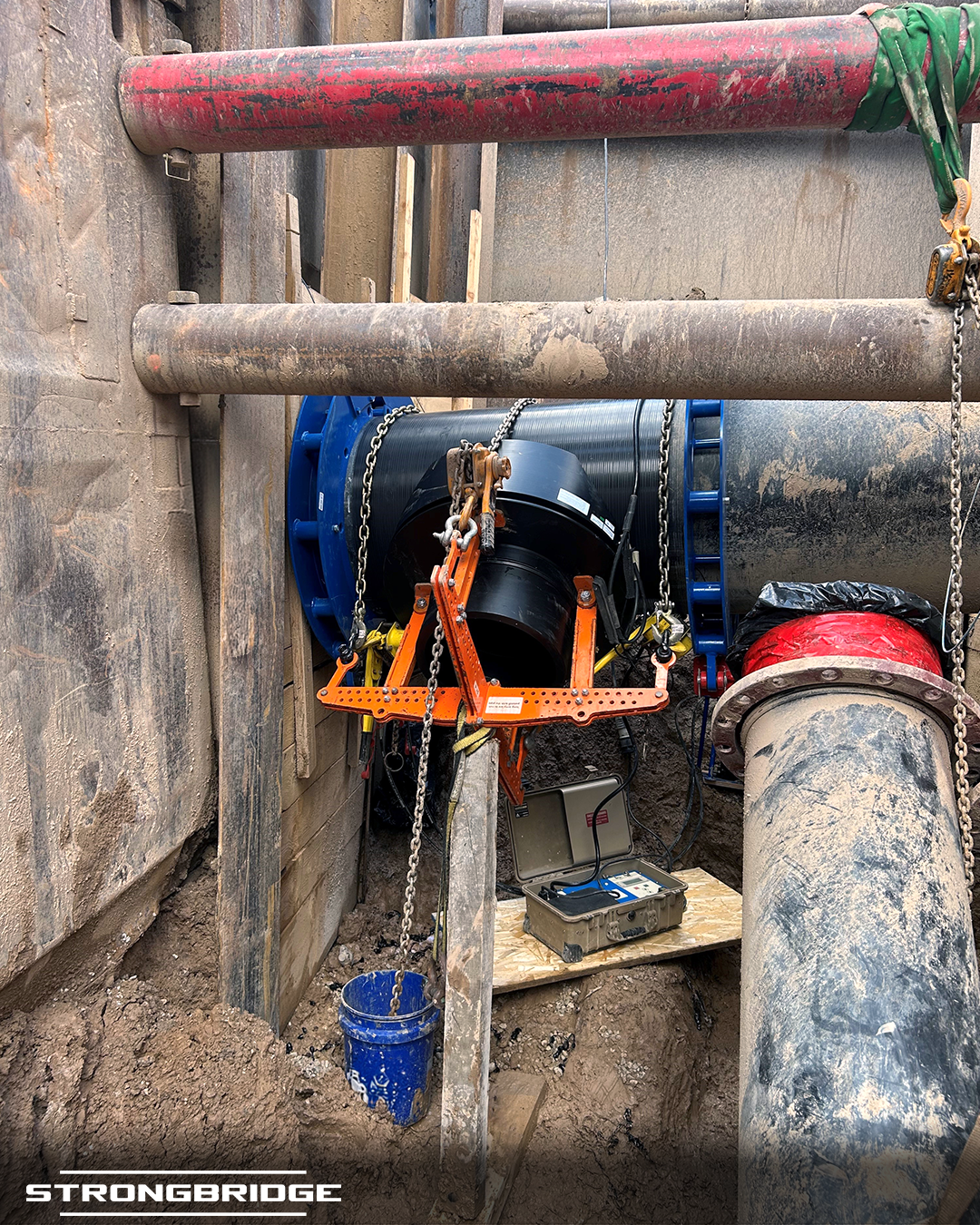 Strongbridge electrofusion 28” IPS x 18” IPS large-diameter branch saddle, angled 45-degrees downward from the main line