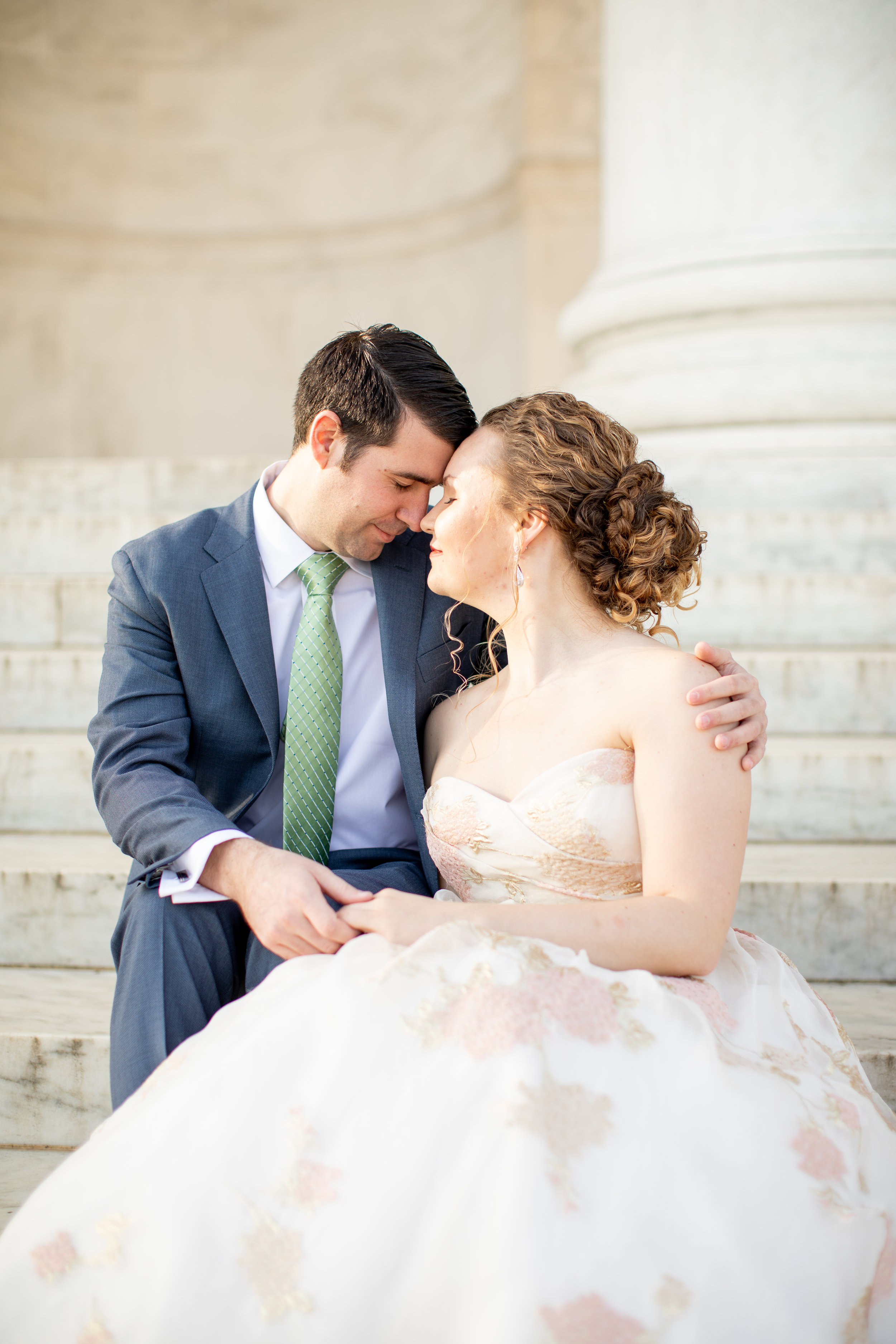 Couple portrait. She has natural tight curls we've embraced in an updo.