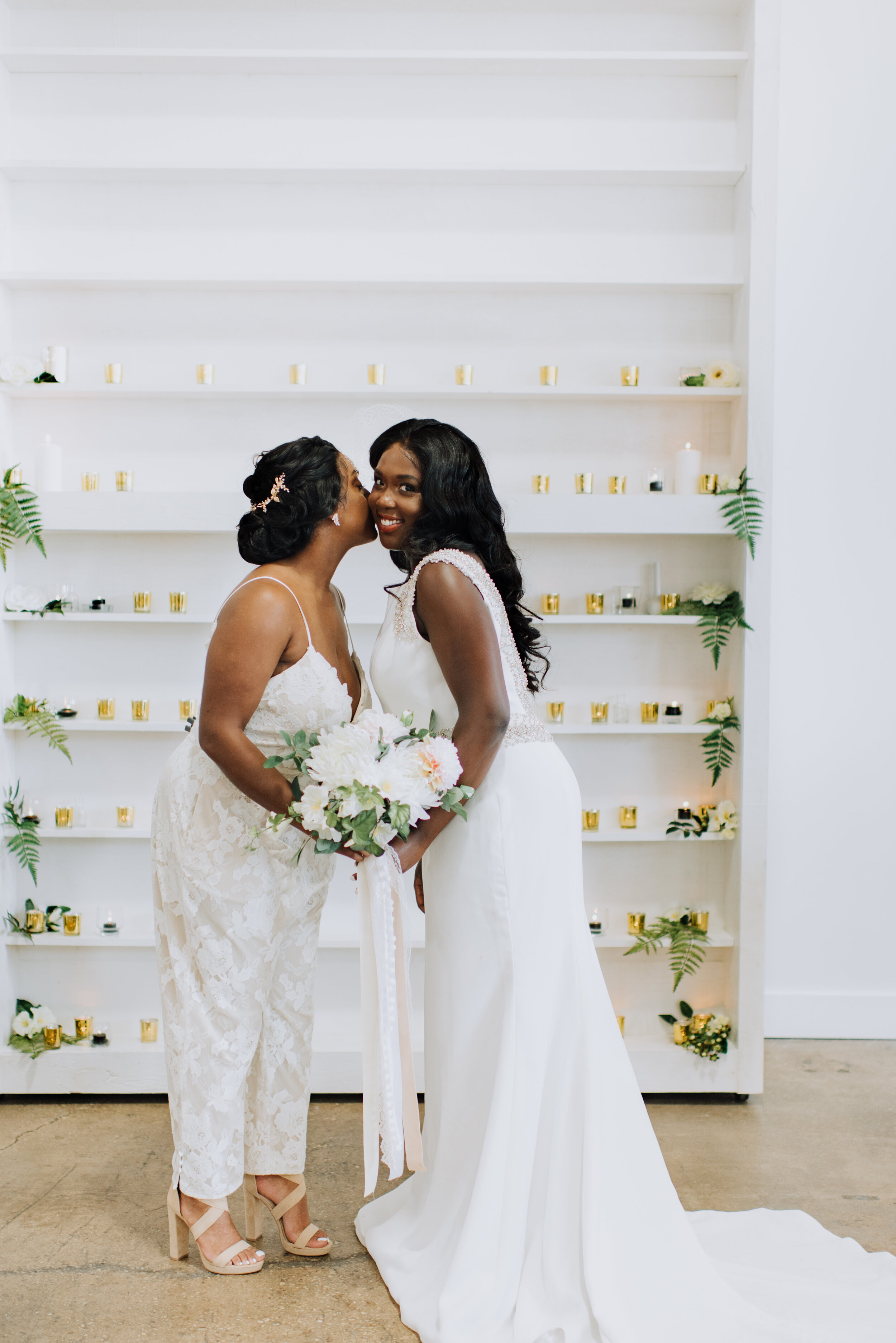 Two African American Brides with glam wedding makeup and hair