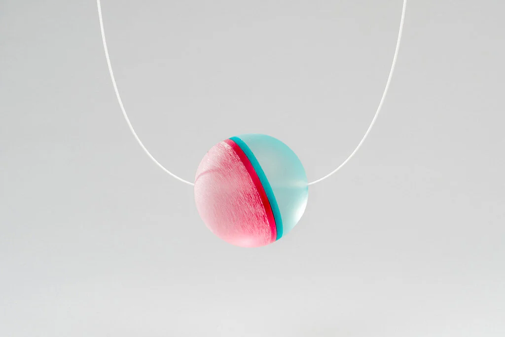 Haze Reflector Pendant 2, 2016 Carved acrylic, powder coated silver, guitar string Image by Grace Laemmler
