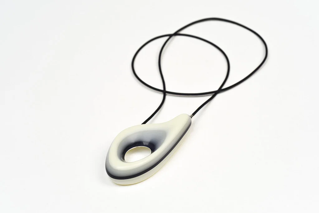 Cookies and Cream Pendant, 2016 Carved acrylic, sterling silver, leather Image by Grace Laemmler