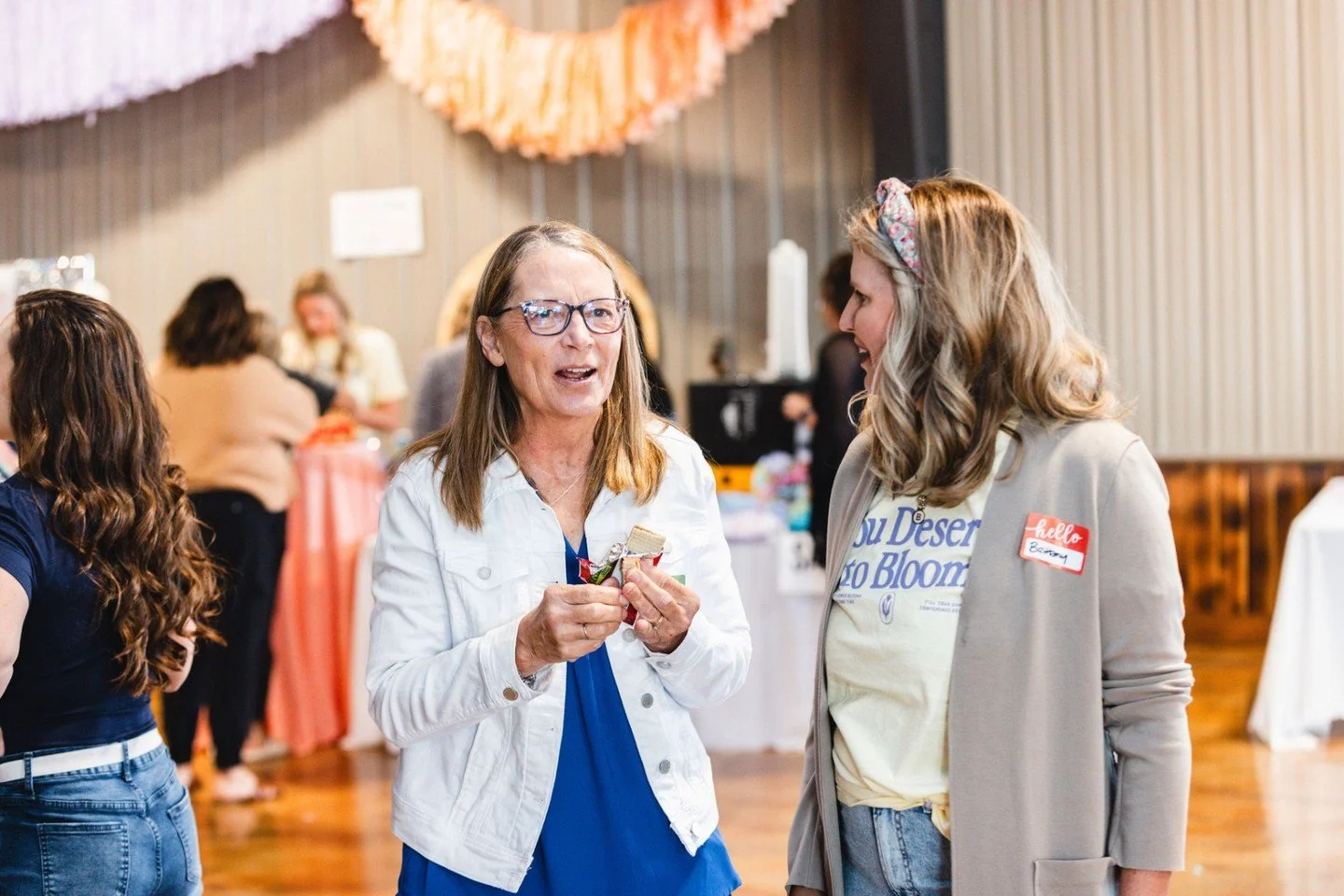 The first thing you&rsquo;ll notice when you walk in isn&rsquo;t the stage.

It&rsquo;s the smile.

The kind that quietly says, &ldquo;You&rsquo;re in the right place.&rdquo;

Our volunteers don&rsquo;t just hand you a name tag and point you toward t