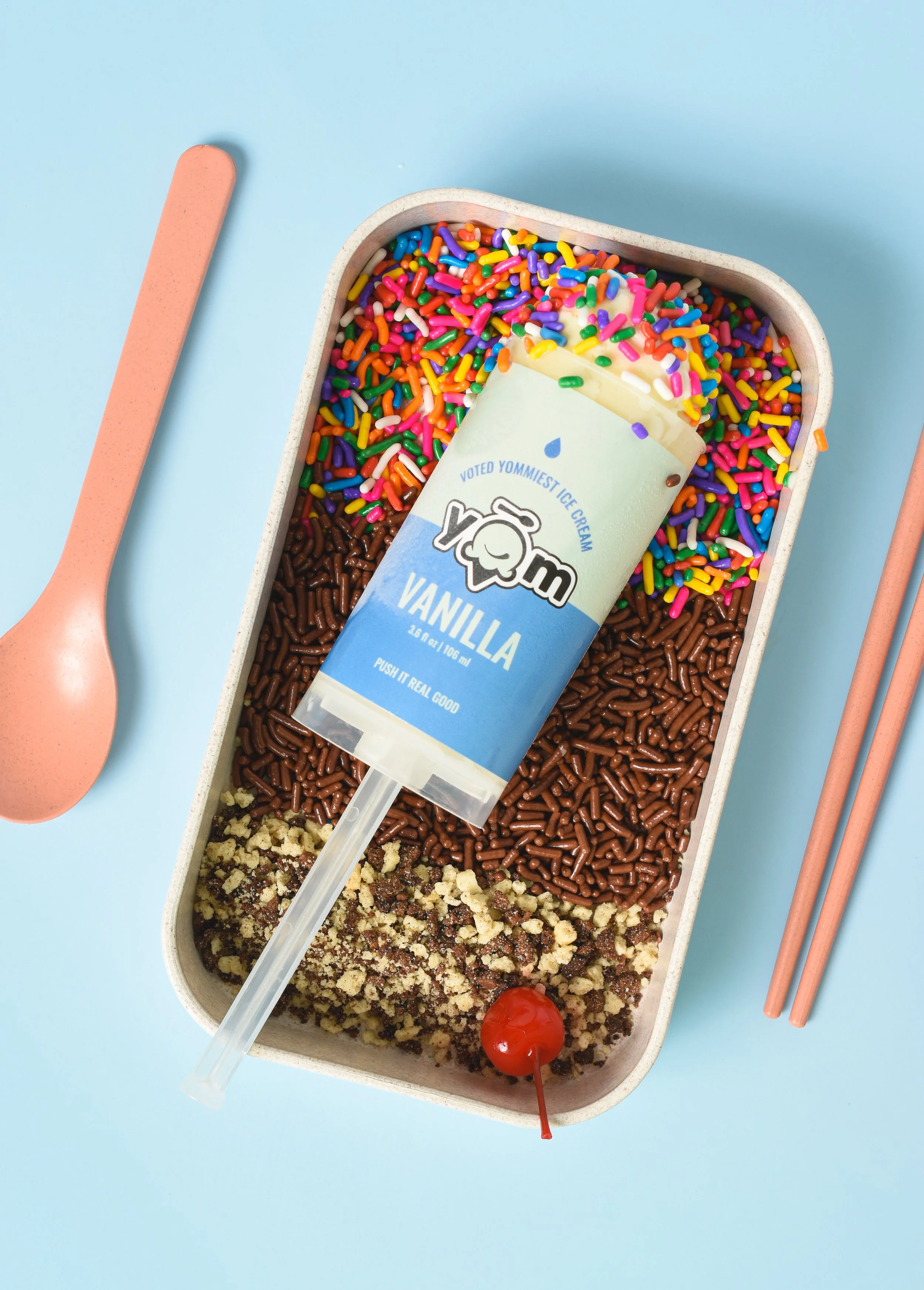 YOM vanilla ice cream push pop with colorful sprinkles