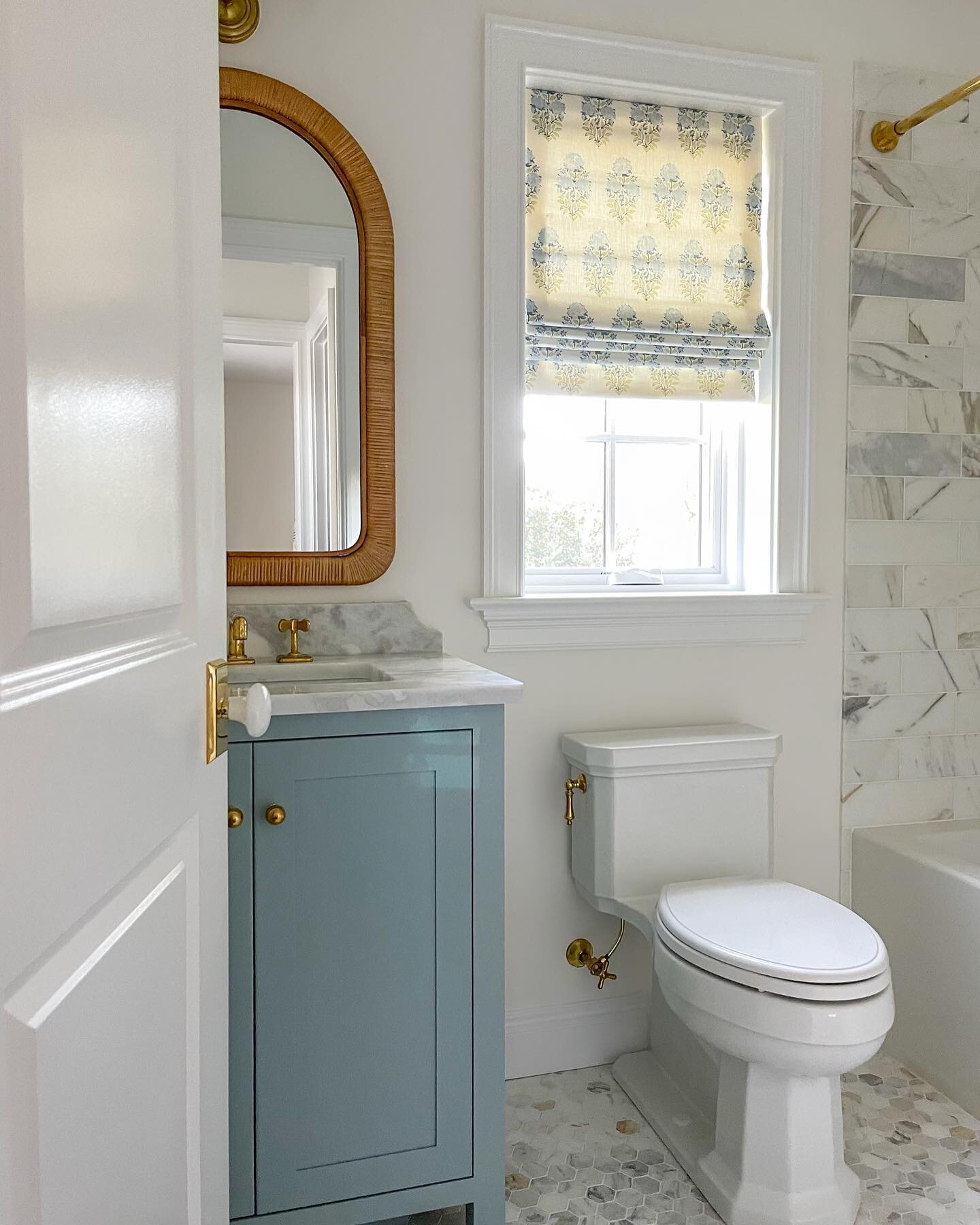 Which one do you think was easier - matching the cabinetry color to the roman shade fabric, or taking a nice picture of this tiny guest bathroom with sunlight beaming into the camera lens? I&rsquo;ll give you one guess. 🙃