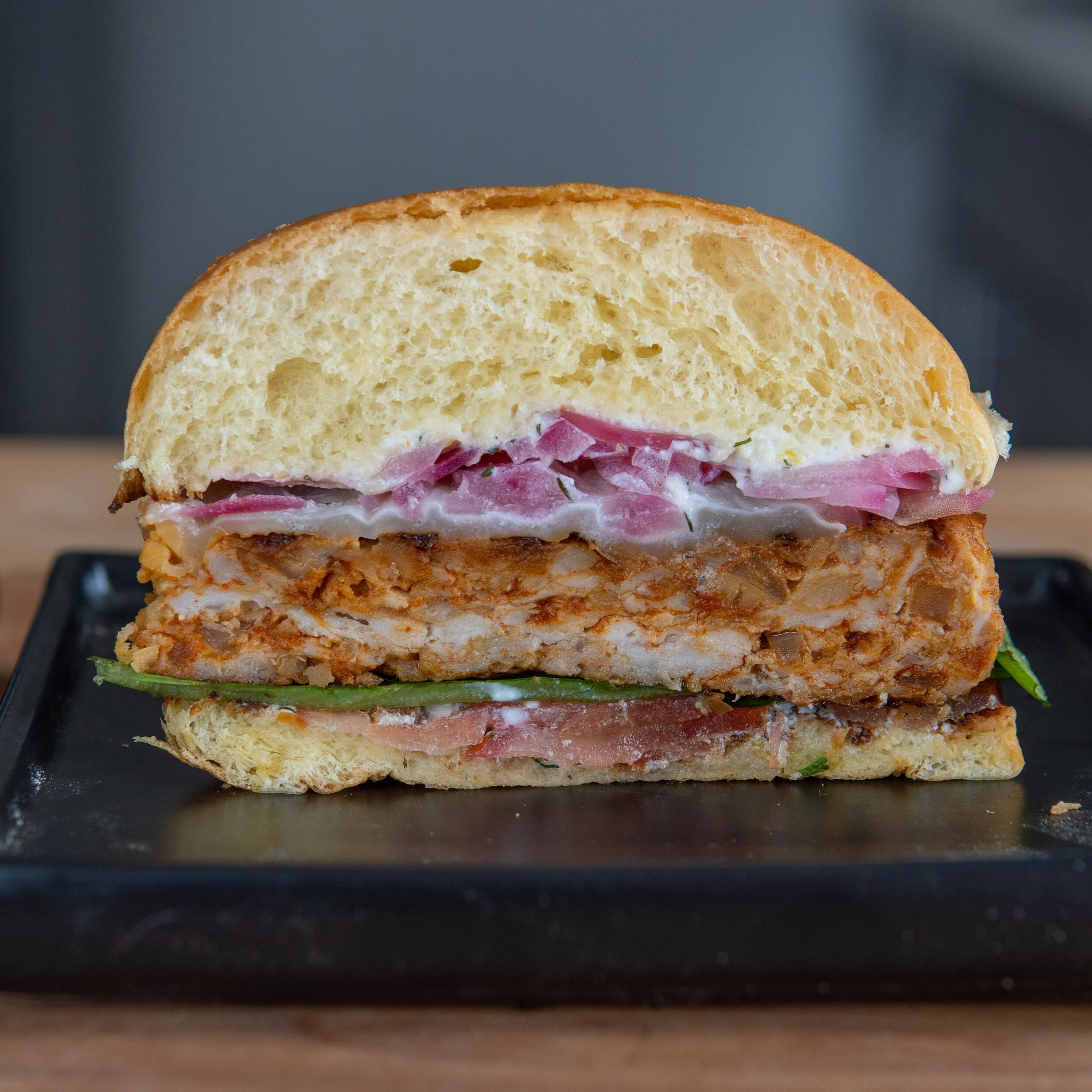 Cross section with the self ground chicken. This has a loose texture closer to a typical beef burger.