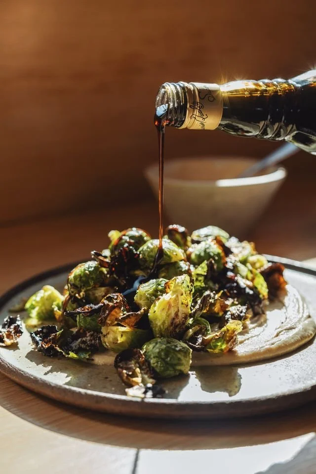 oven roasted brussels sprouts with tahini and pomegranate
