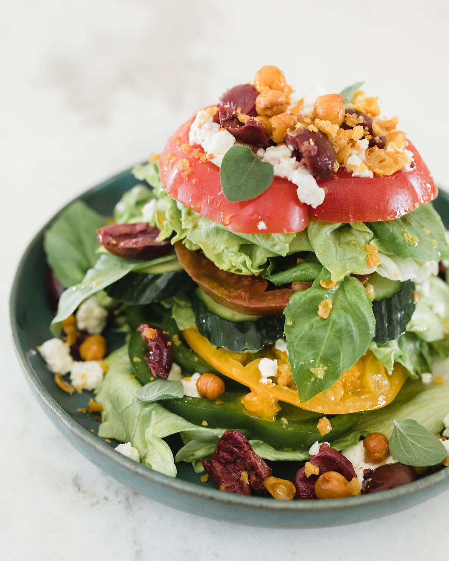 We love a creative take on a salad, like this baby iceberg stacked salad! Stack up layers of crisp baby iceberg, alternating with layers of heirloom tomatoes, bell pepper and cucumber, and top with crispy fried chickpeas, feta cheese, kalamata olives