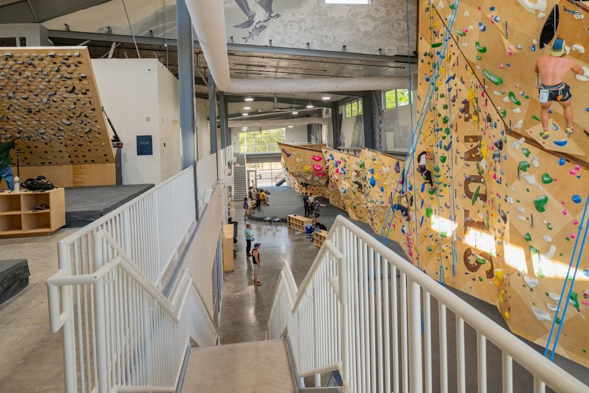 Climbers on Tension board, rope walls, and bouldering at stone climbing jacksonville.