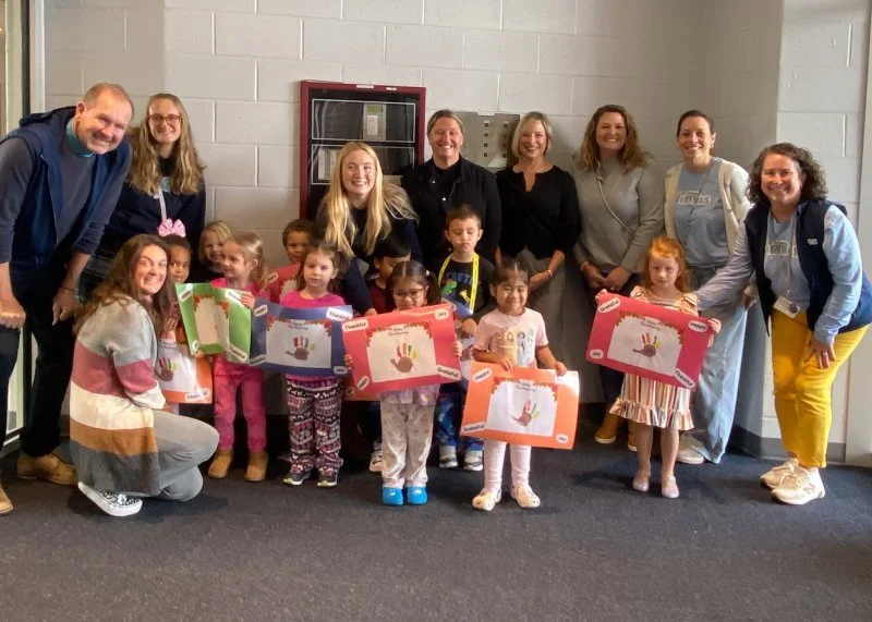 Little Vikings decorate holiday placemats for Meals on Wheels