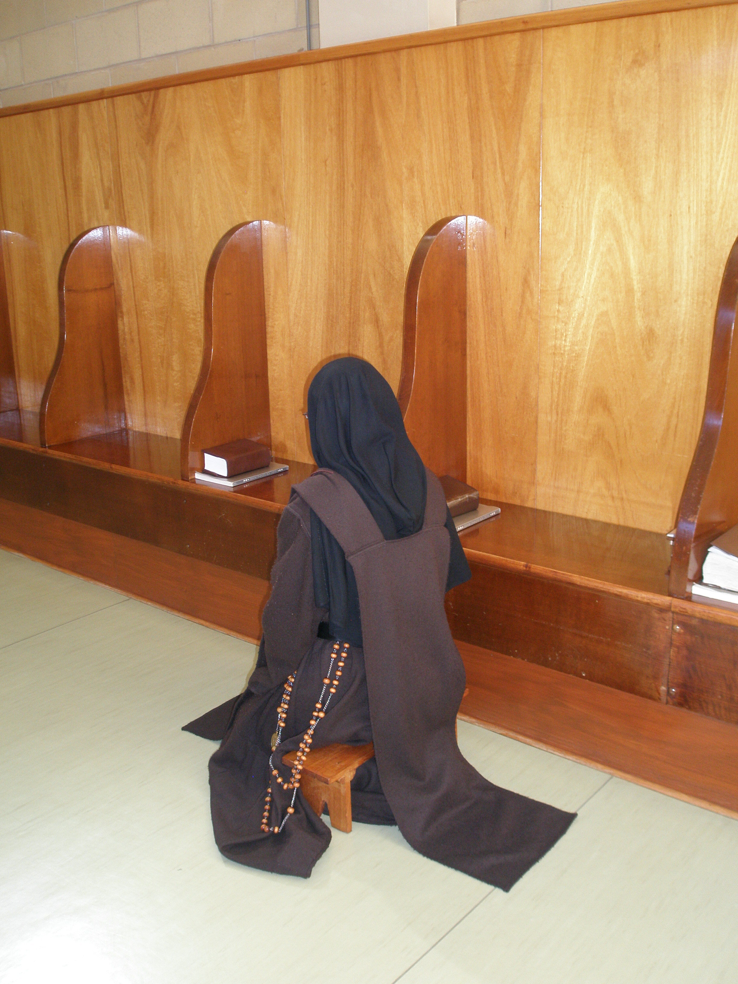 Sister on prayer stool 2.JPG