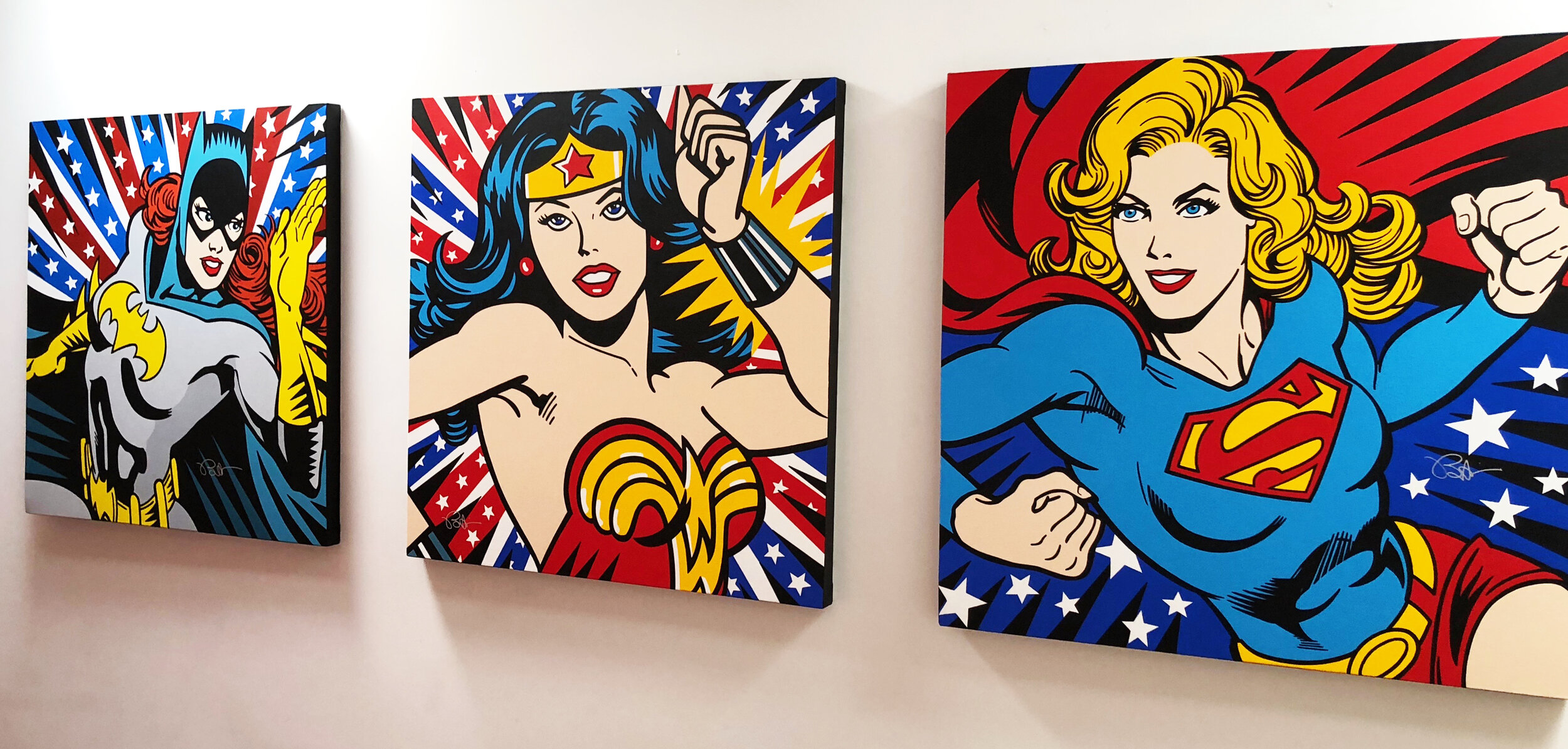 Supergirls art on wall.jpg