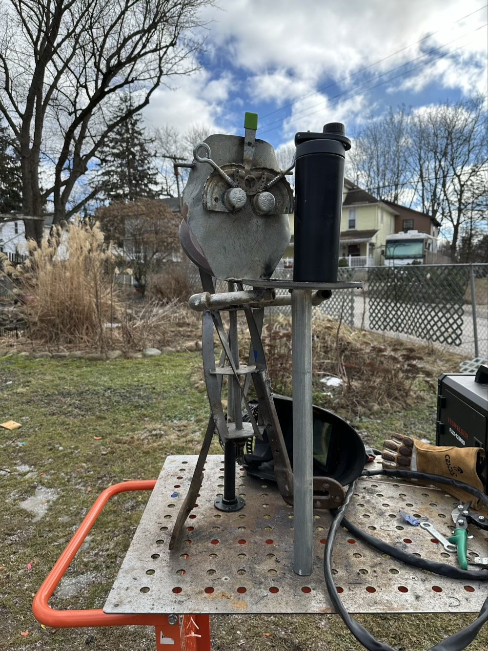 lon the metal guy holds a water bottle outside