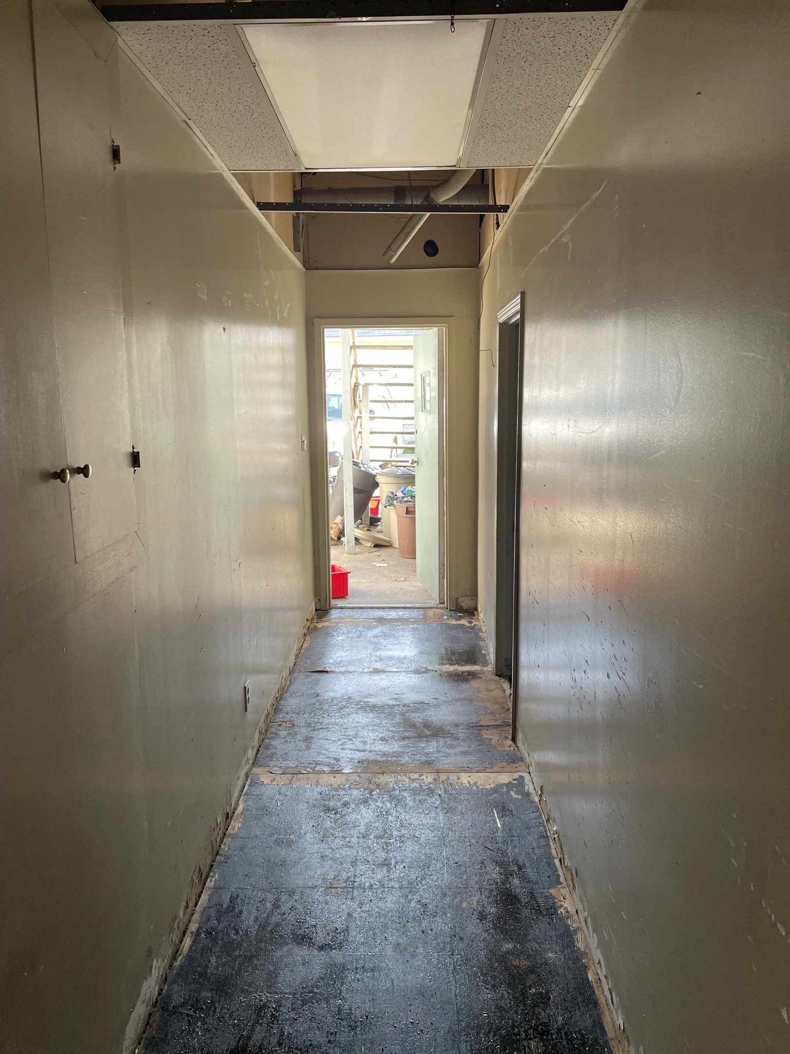 Asbestos mastic covered hallway