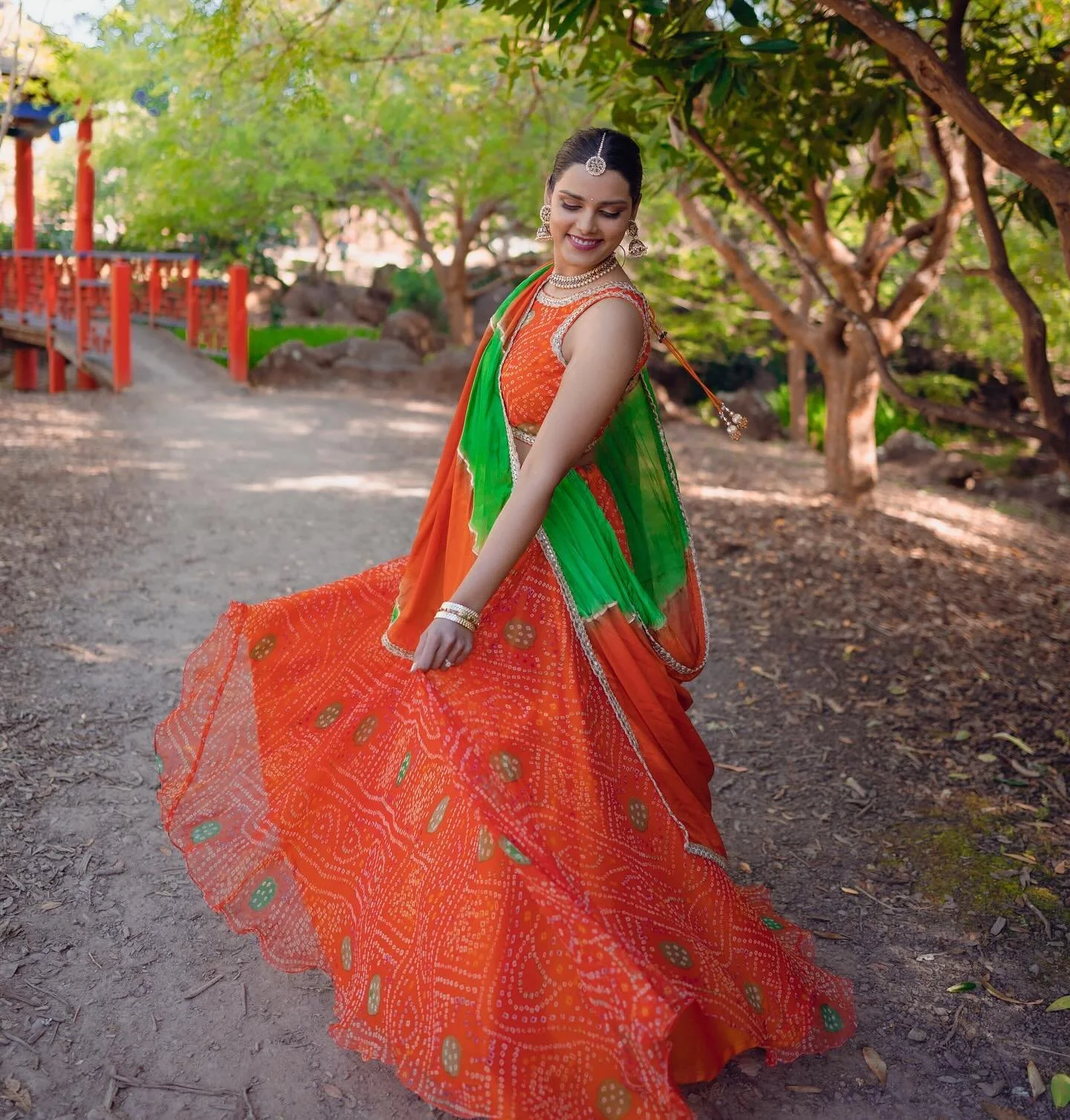 This vibrant lehenga with beautiful bandani work from @seemabatra is a classical addition to any festive wardrobe! It&rsquo;s super light and comfortable, making it the perfect choice for garba during navratri time.
.
Swipe 👉 for their stunning lehr