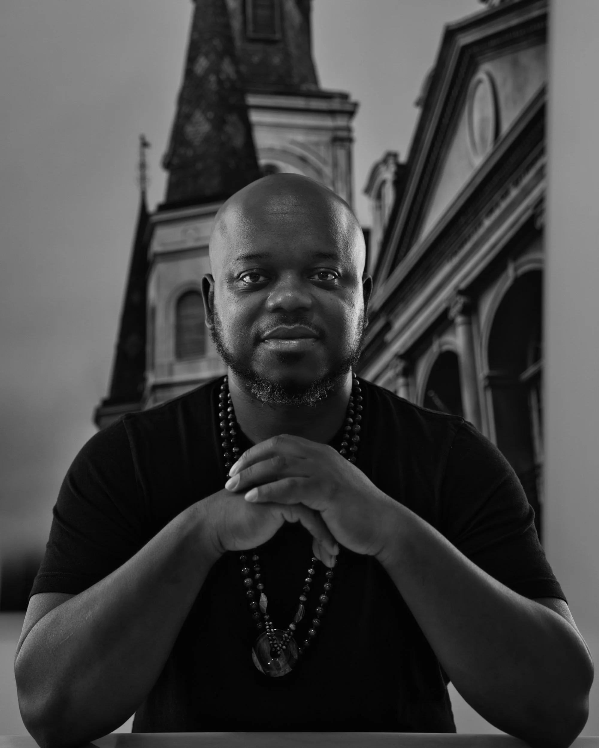 Black and white headshot of Navy Veteran and artist Angelo T. Robinson by Photophobic Images.